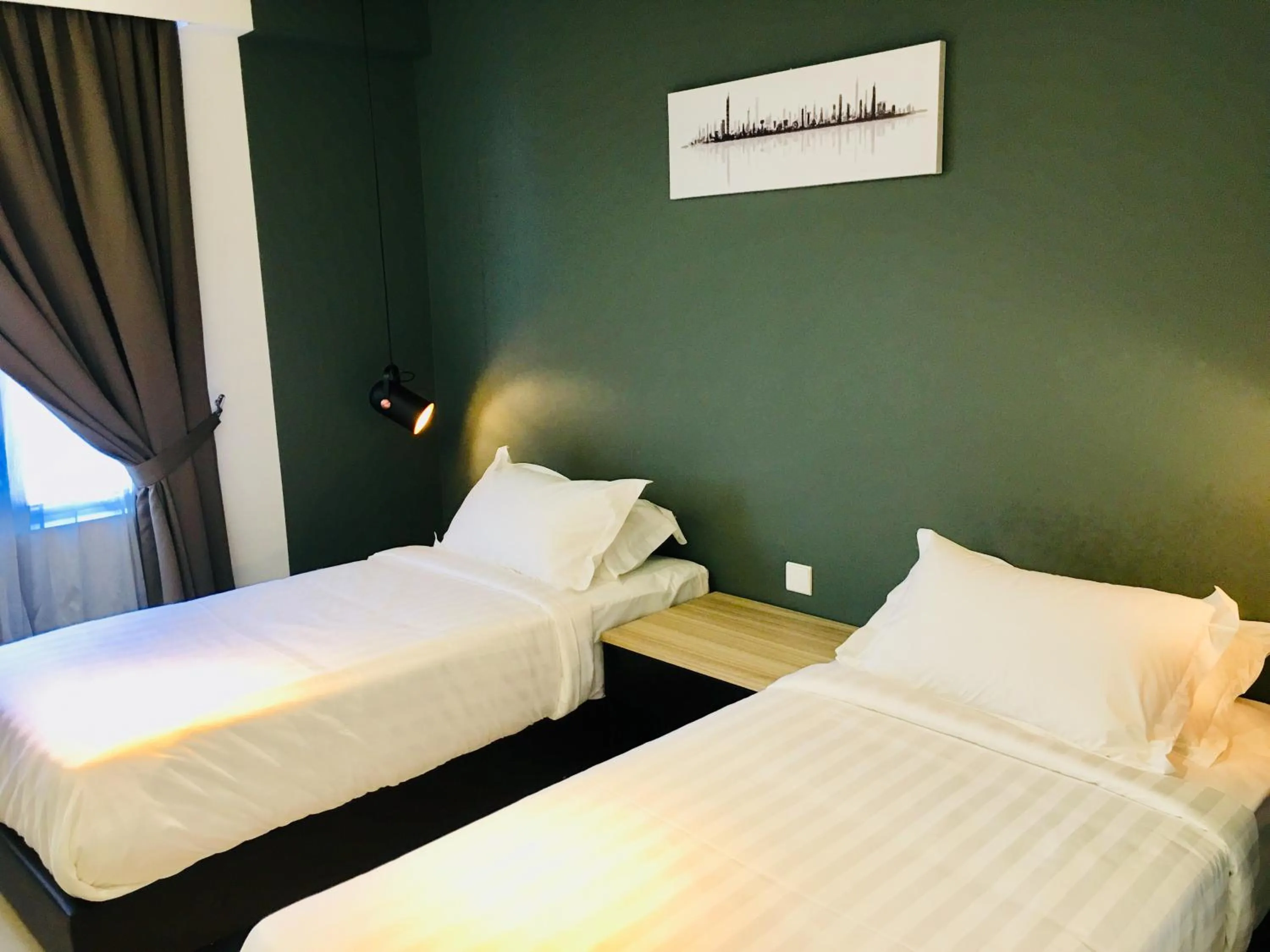 Bed in Enclave Business Hotel