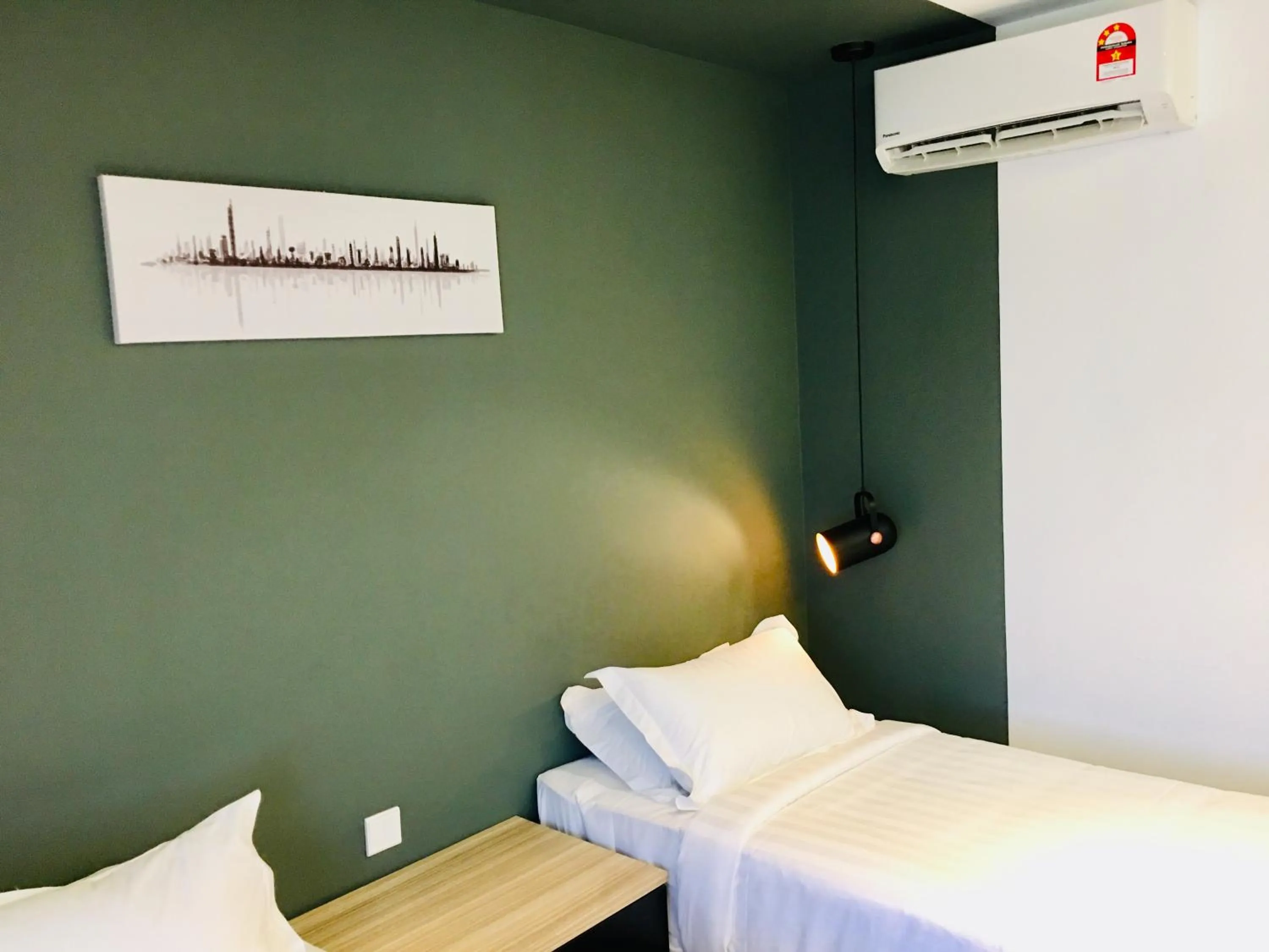 Bed in Enclave Business Hotel