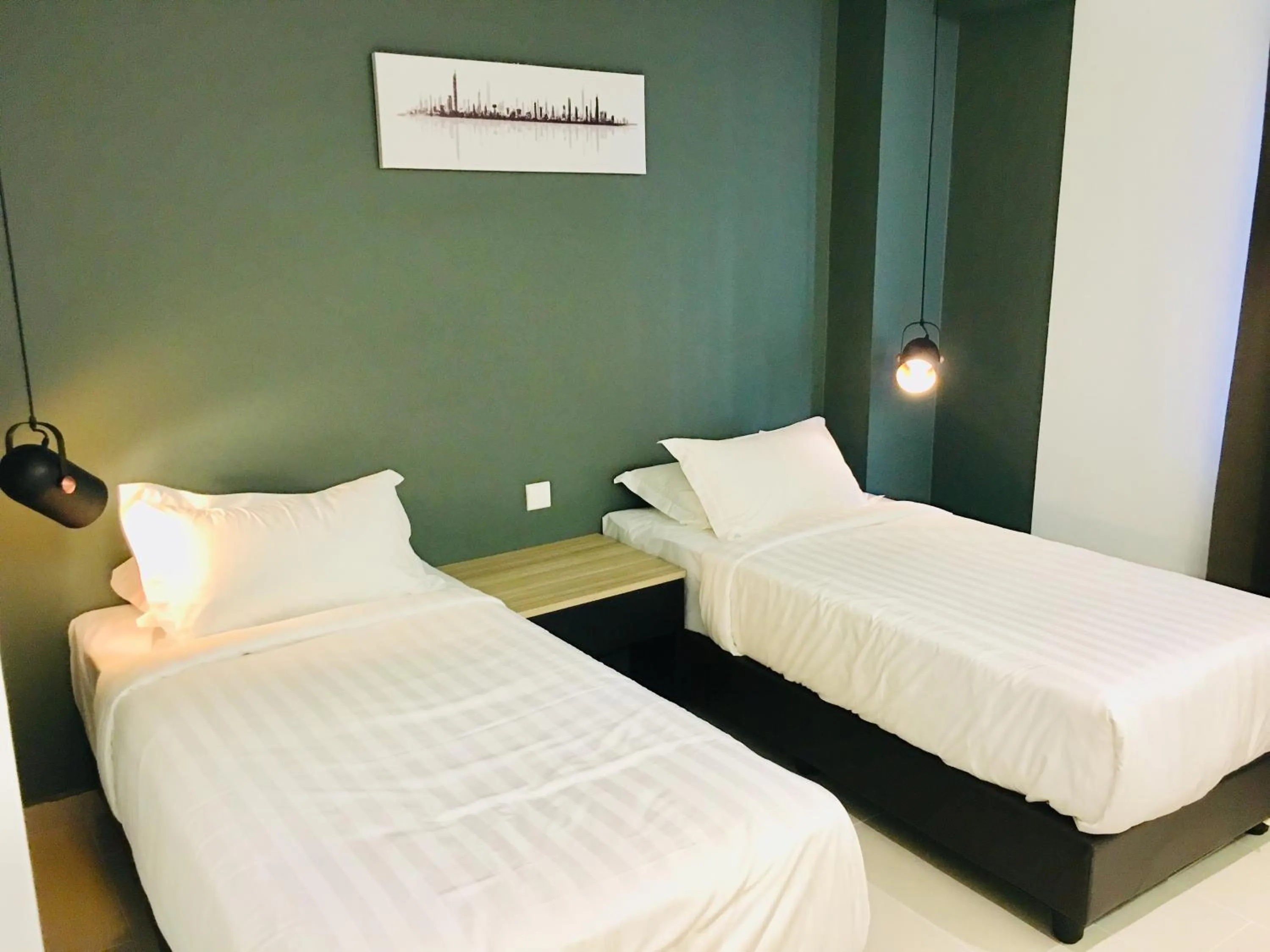 Bed in Enclave Business Hotel