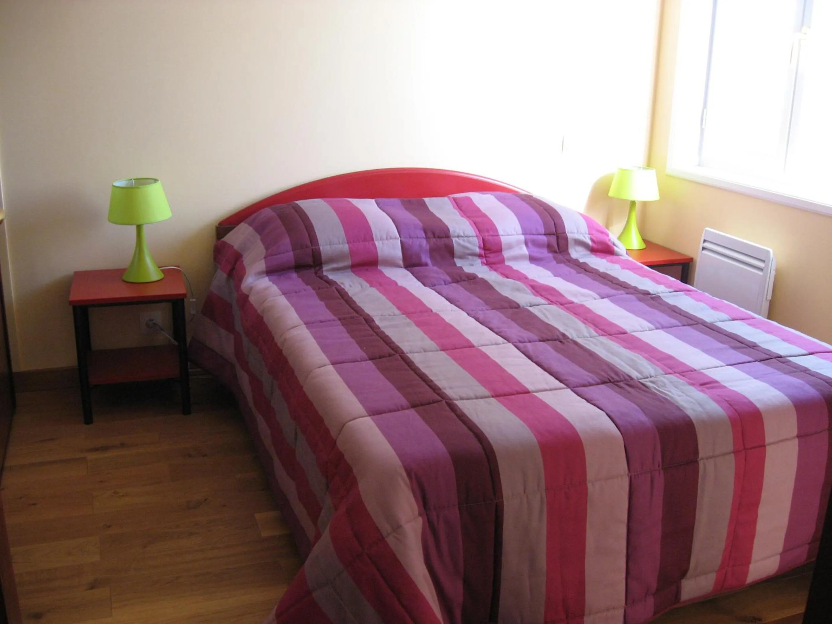 Bed in Appartements la Félicité