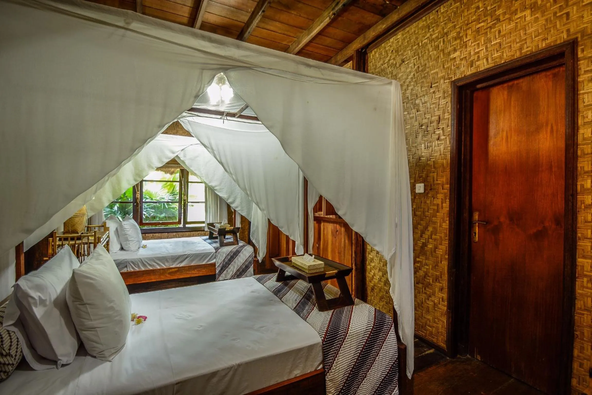 Bed in Aashaya Jasri Resort