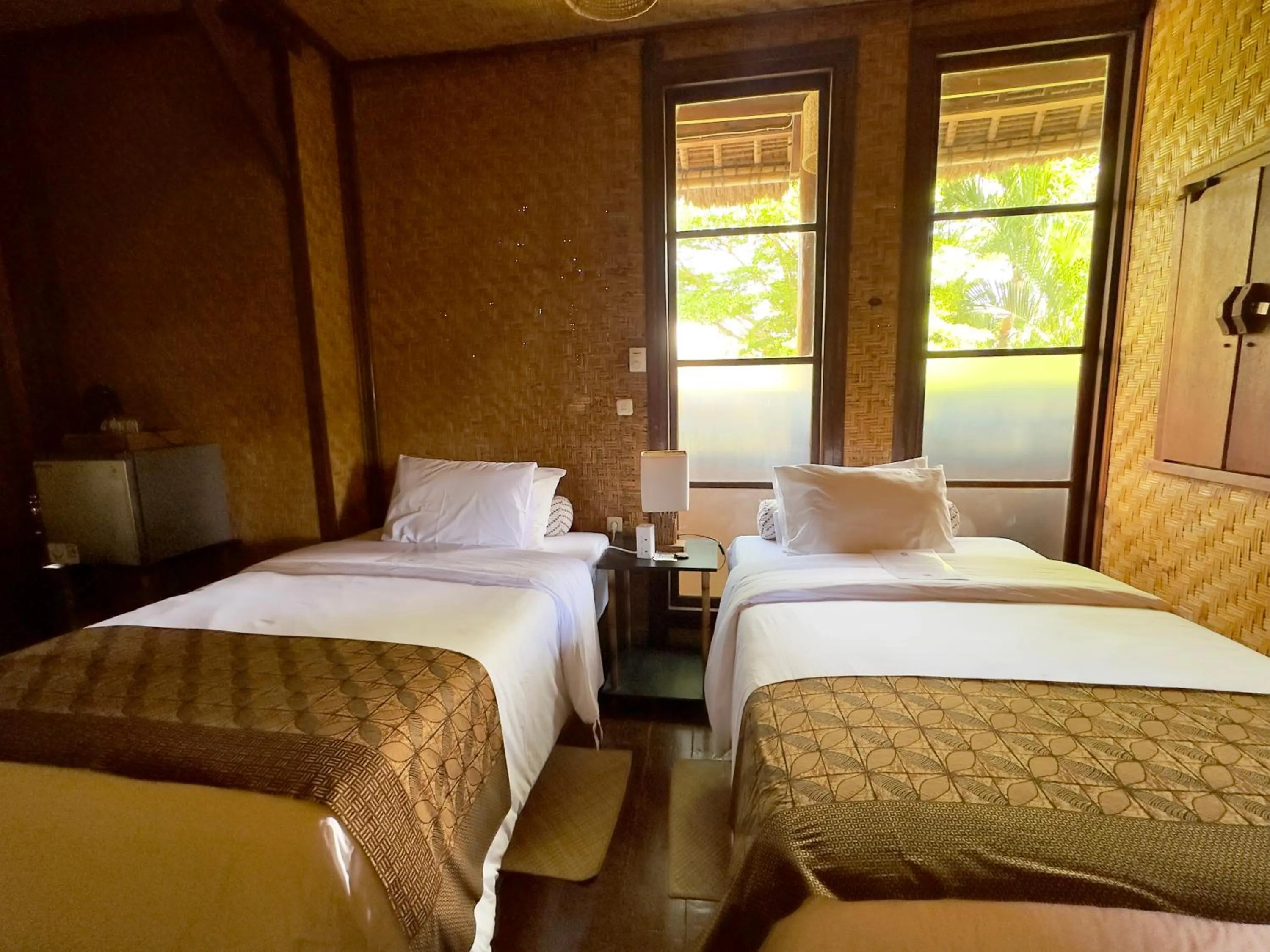 Bed in Aashaya Jasri Resort