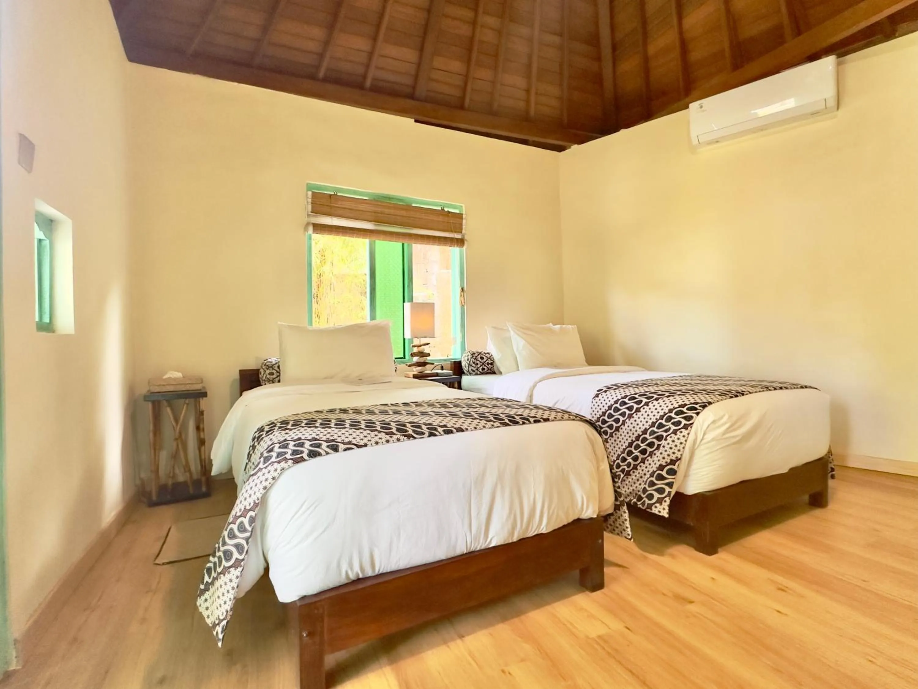 Bed in Aashaya Jasri Resort