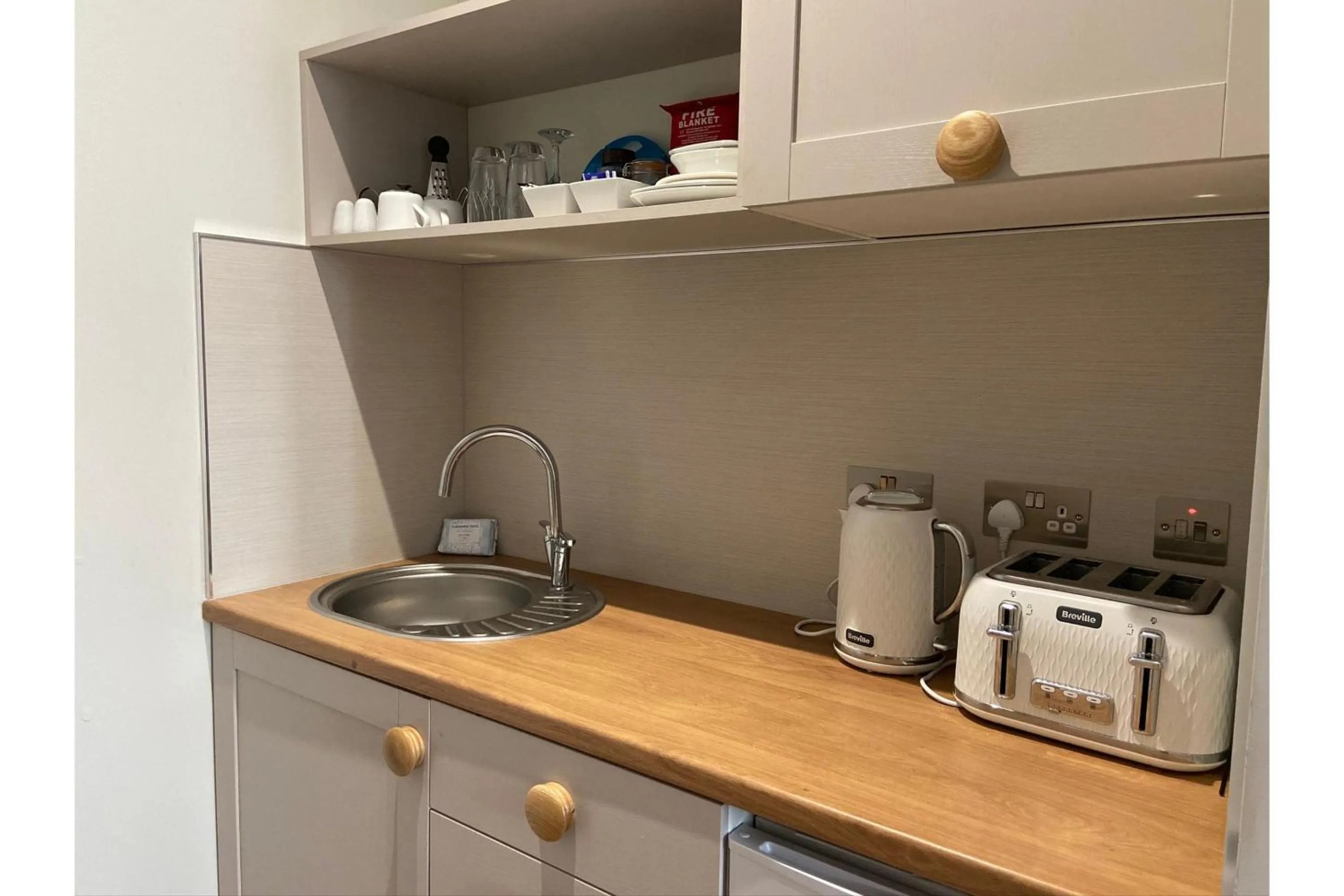 Kitchen or kitchenette in Harmony Apartments