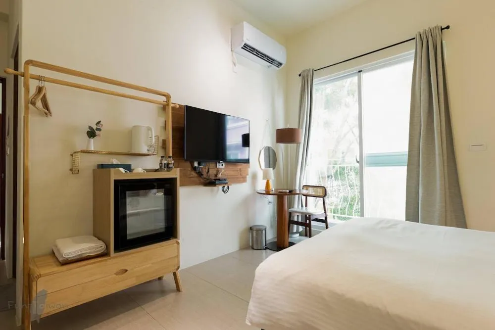 Bed in 沉靛旅宿 La Casa Indaco 墾丁夢幻島Villa