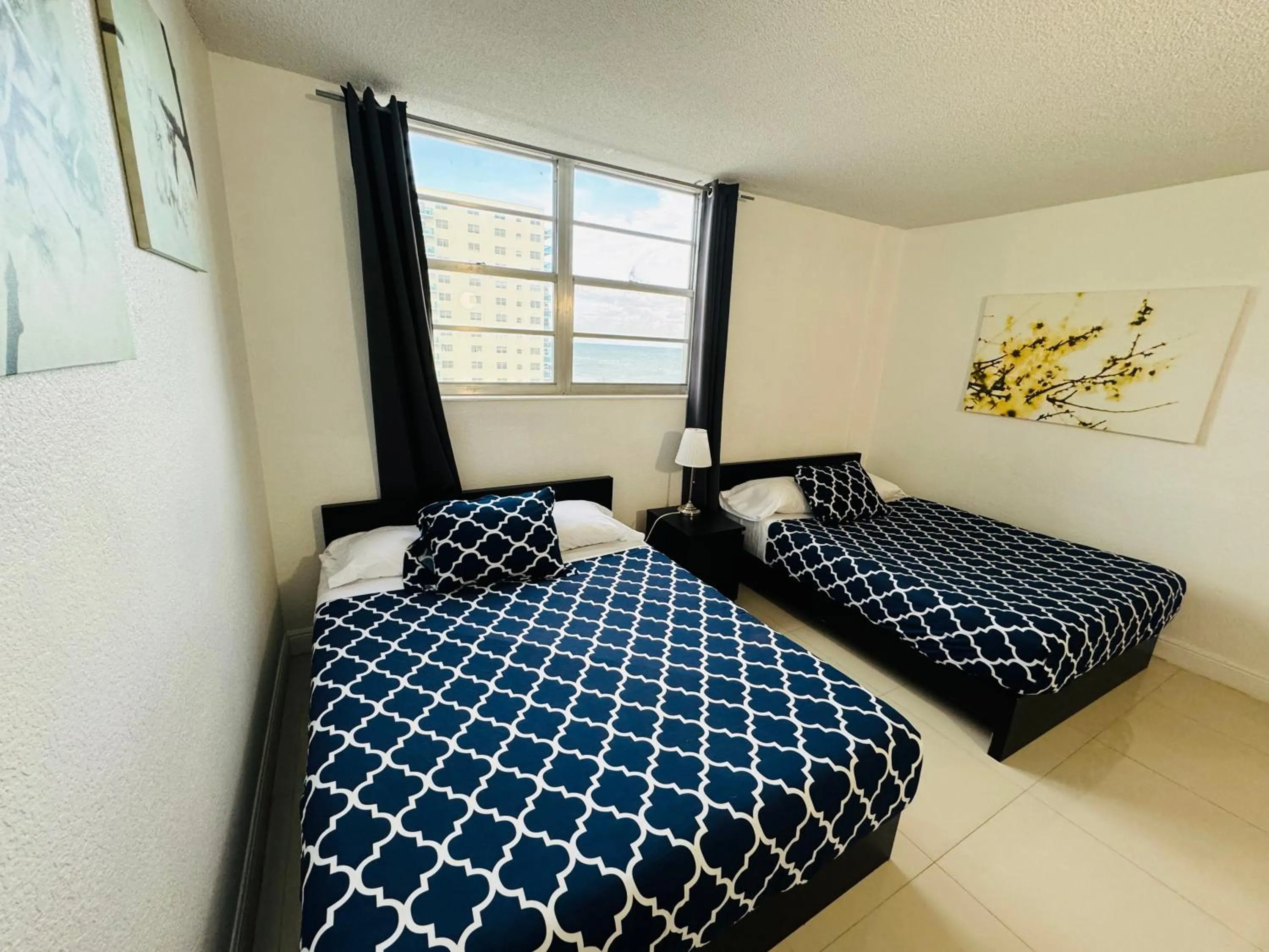 Bed in Hallandale Condo, Partial Ocean View Direct Beach and Pool Access Hollywood Beach