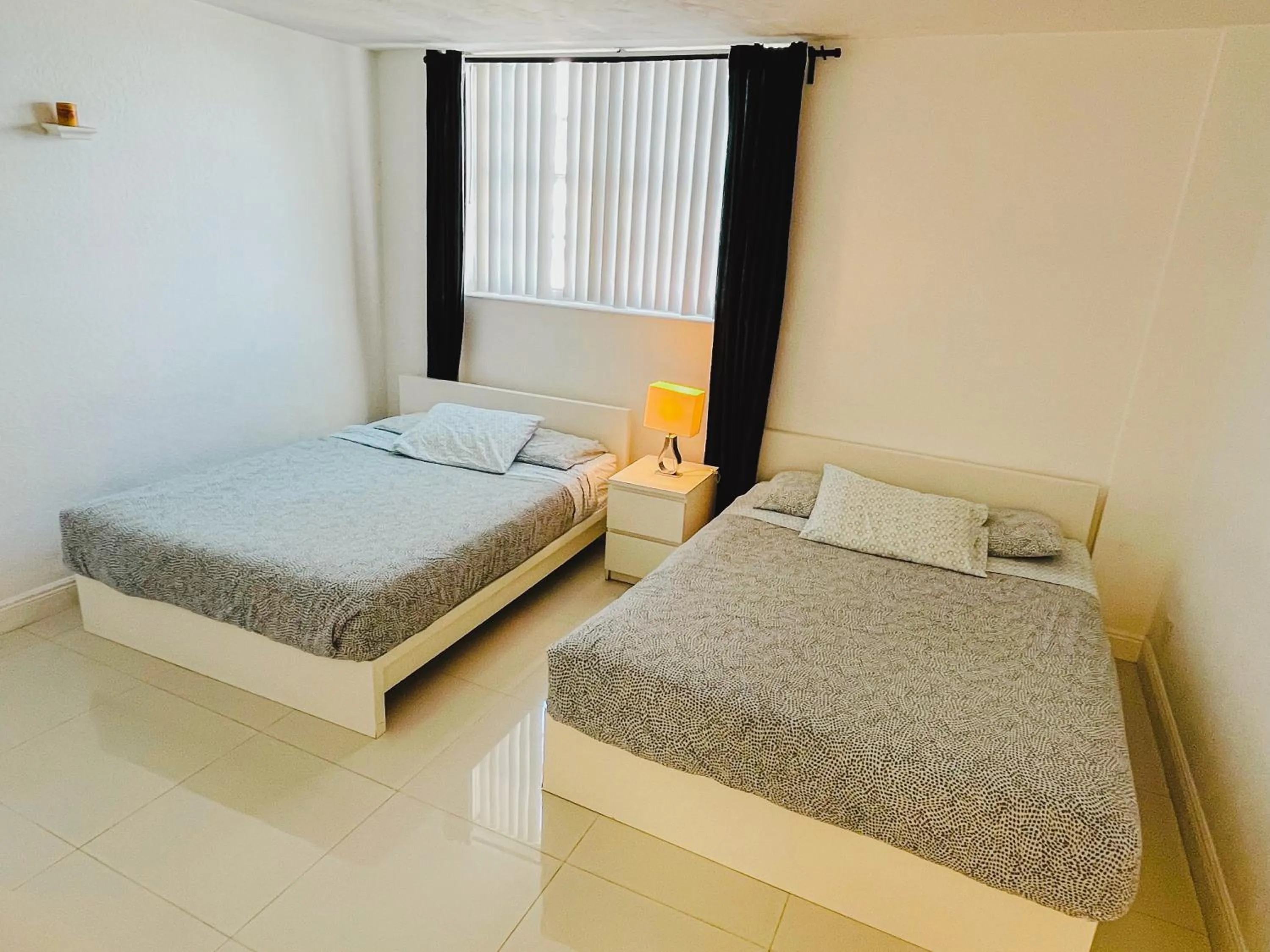 Bed in Hallandale Condo, Partial Ocean View Direct Beach and Pool Access Hollywood Beach