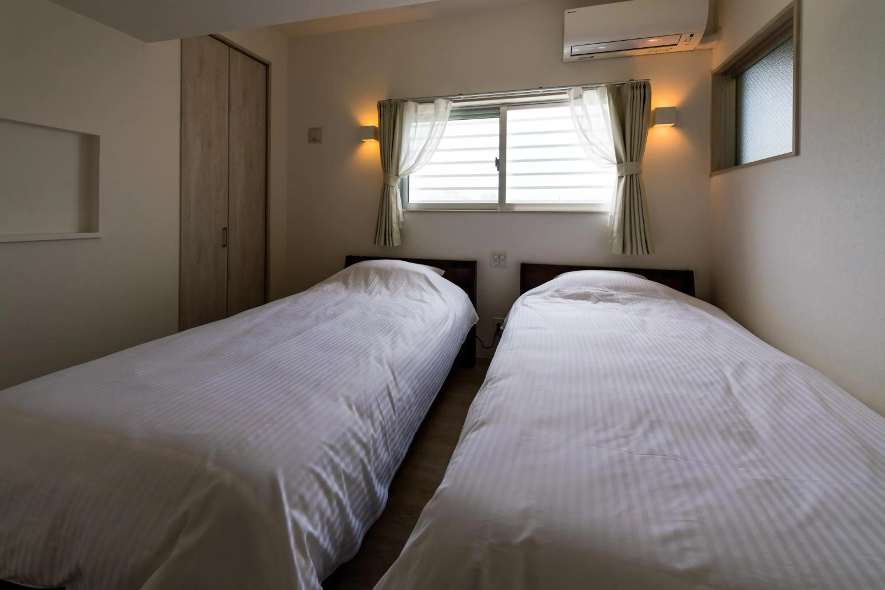 Bedroom, Bed in MINATO Chatan Seaside Condominium