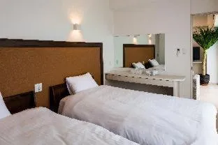 Bedroom, Bed in MINATO Chatan Seaside Condominium