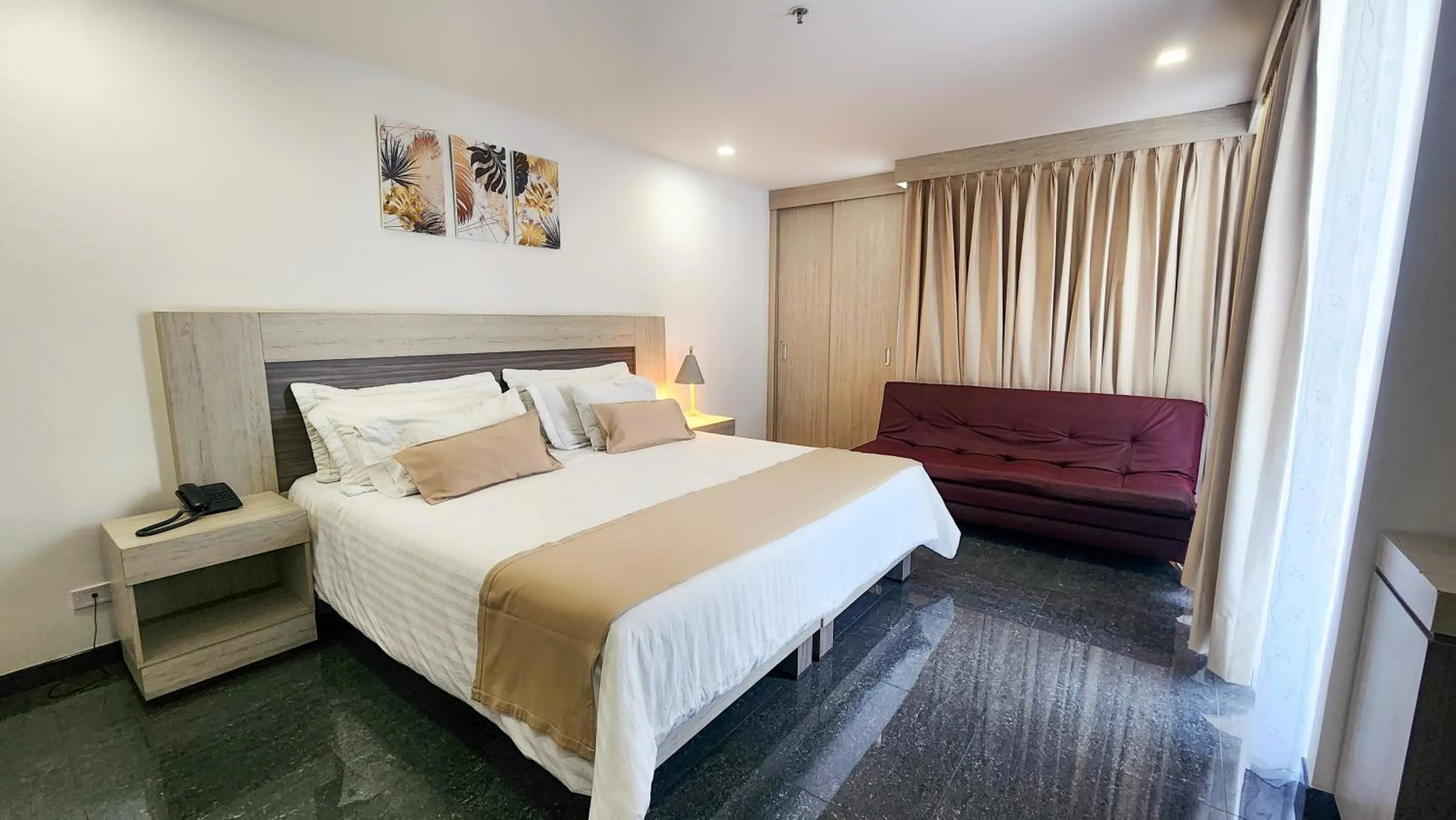 Bed in BE Suites Hotel Cali