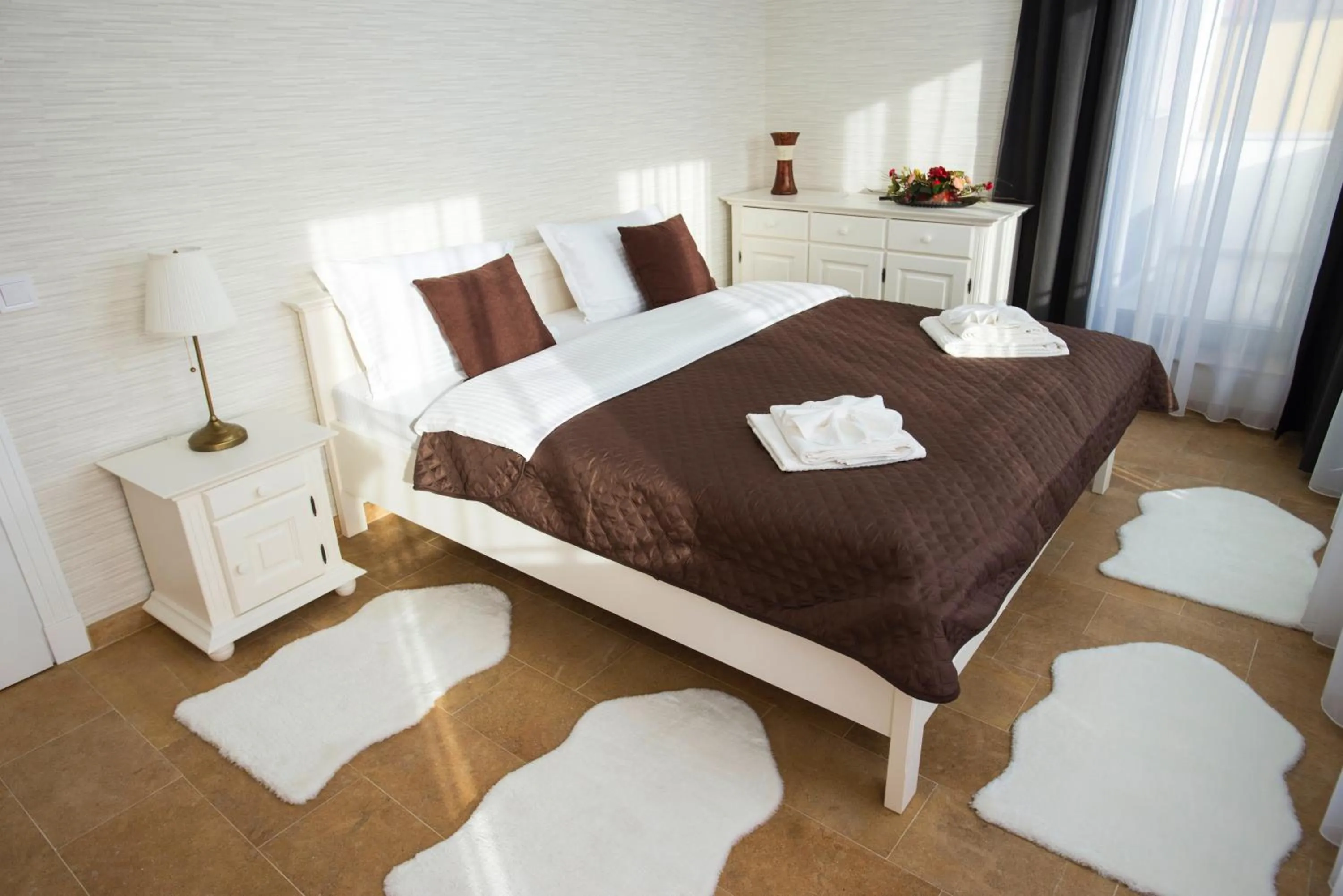 Bed in Lira Holiday Apartments