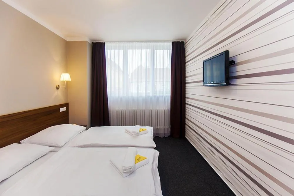 Bed in Hotel Arkáda