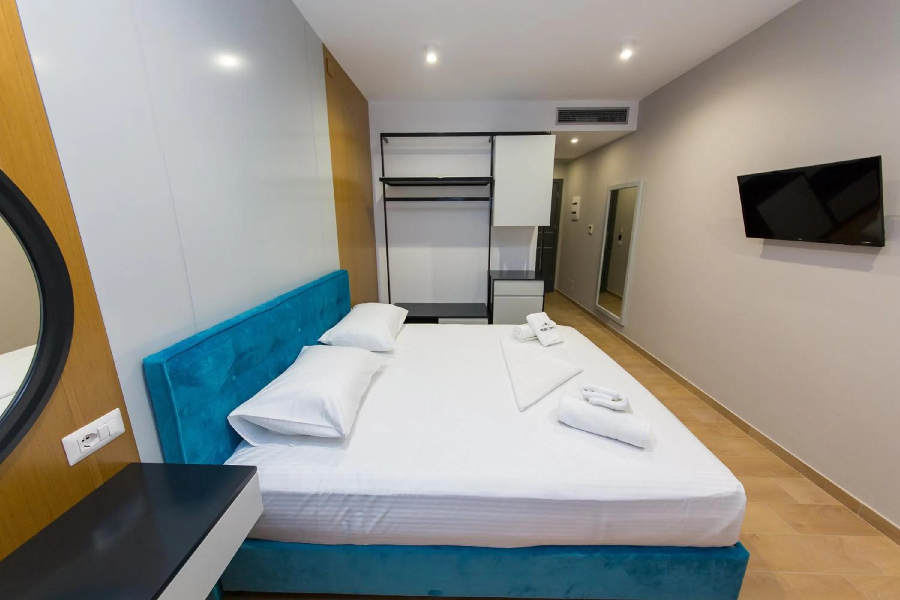 Communal lounge/ TV room, Bed in Delight Hotel