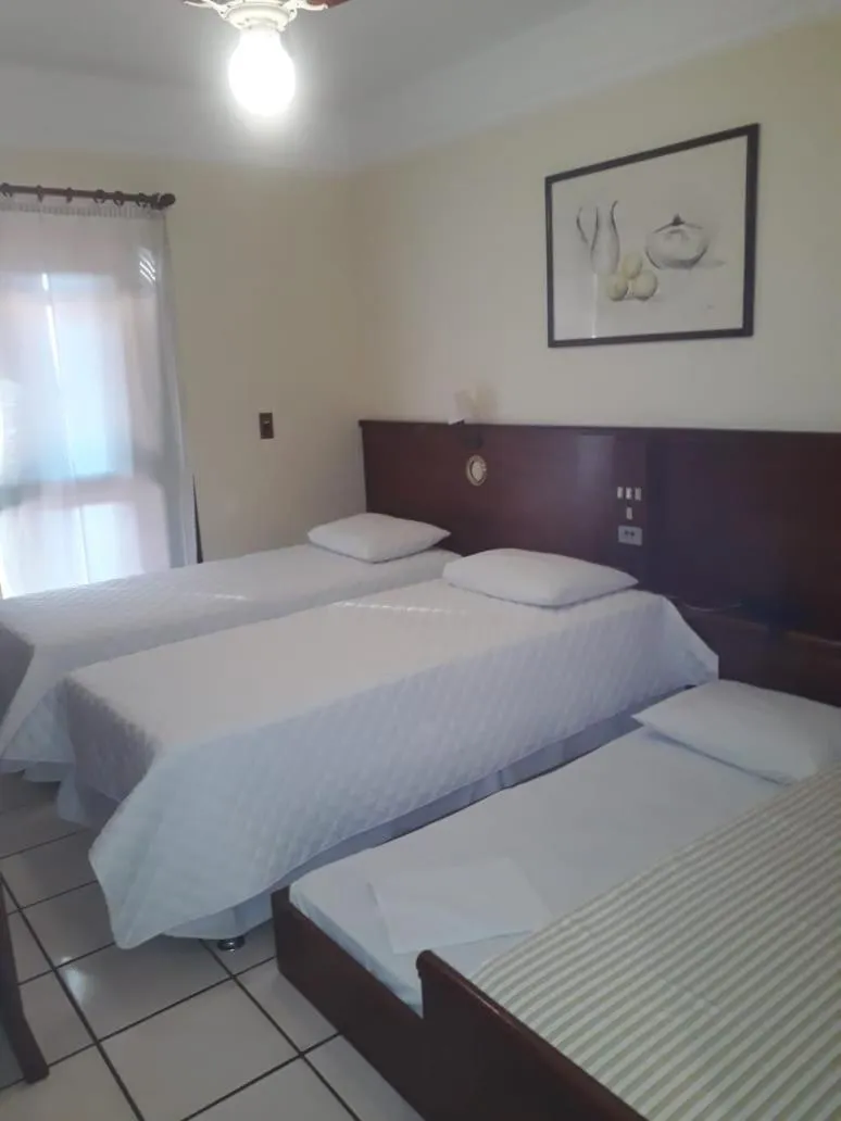 Bed in Hotel Araçá