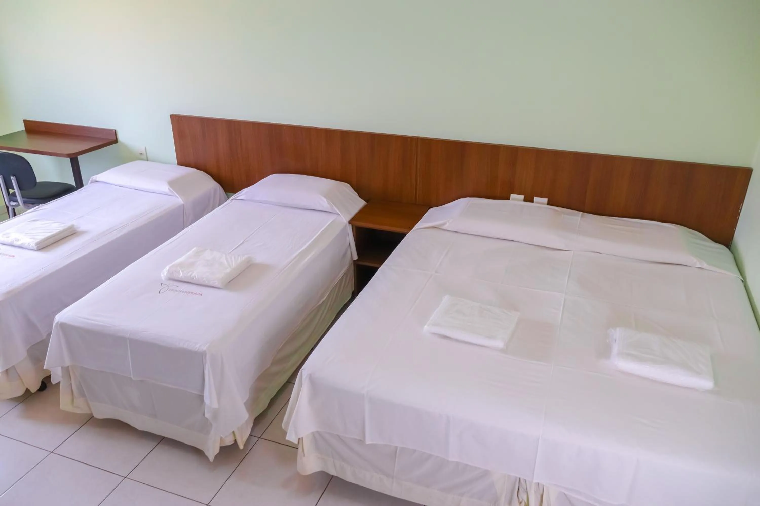 Bed in Trindade Plaza Hotel