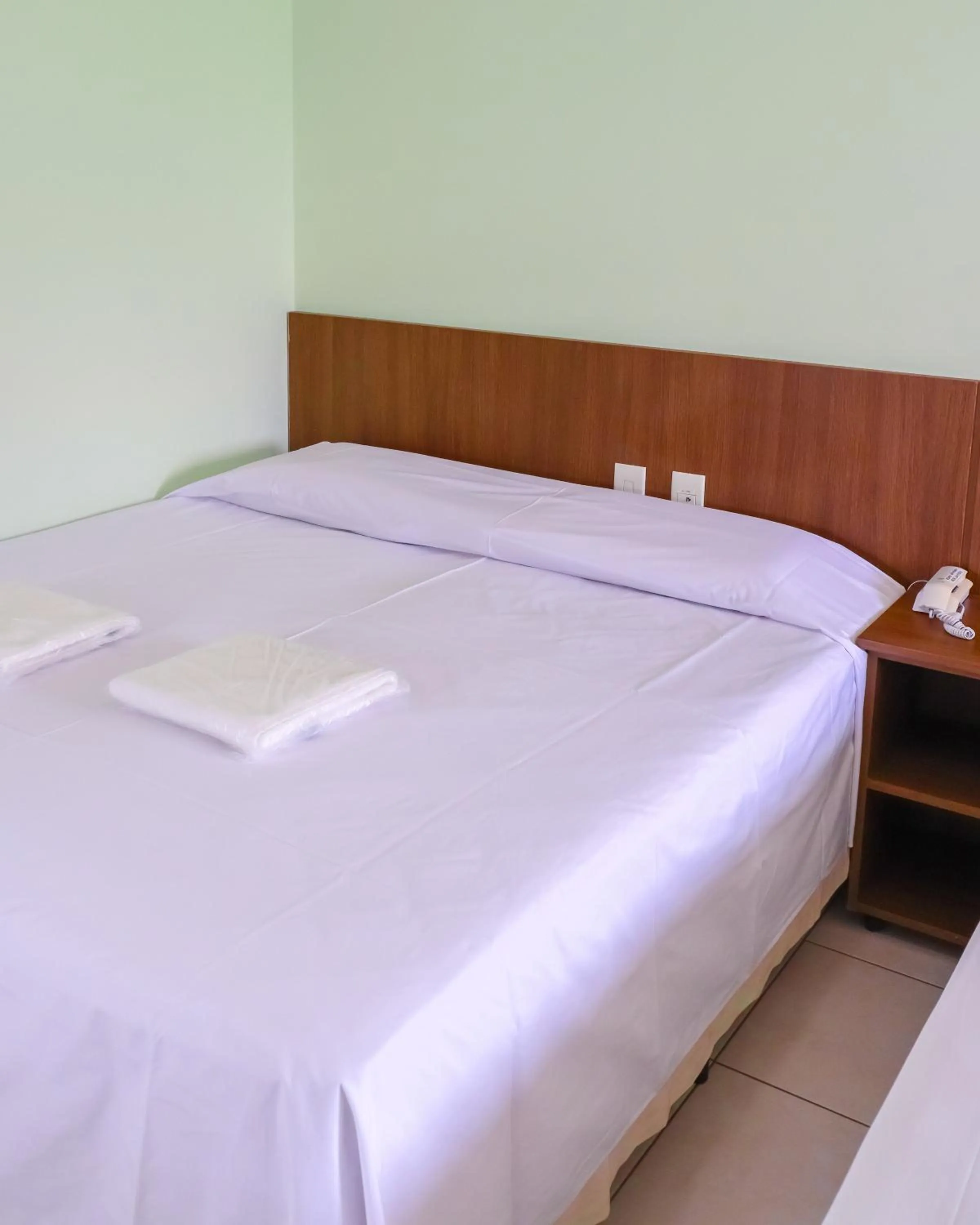 Bed in Trindade Plaza Hotel