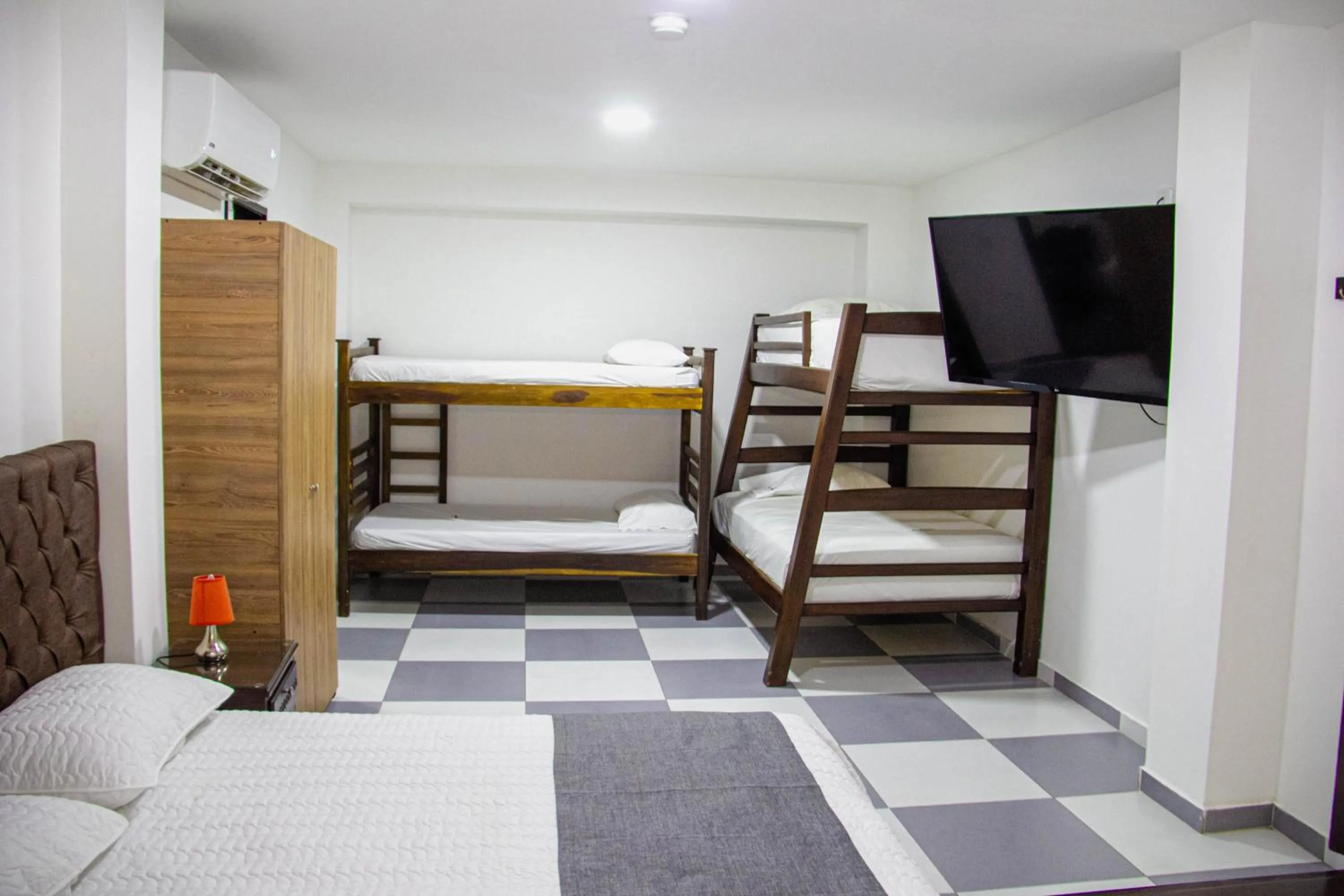 Communal lounge/ TV room, Bed in Hotel El Olimpo