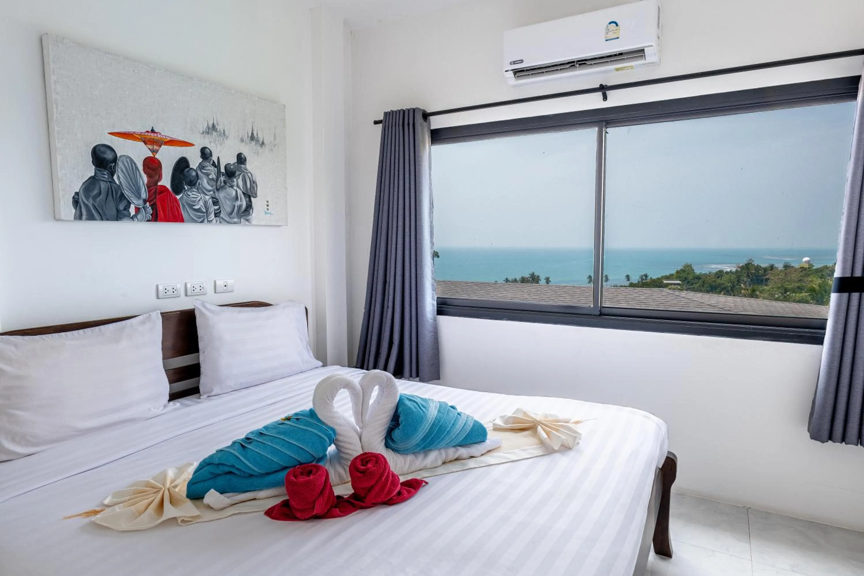 Bed in Tropical Sea View Residence