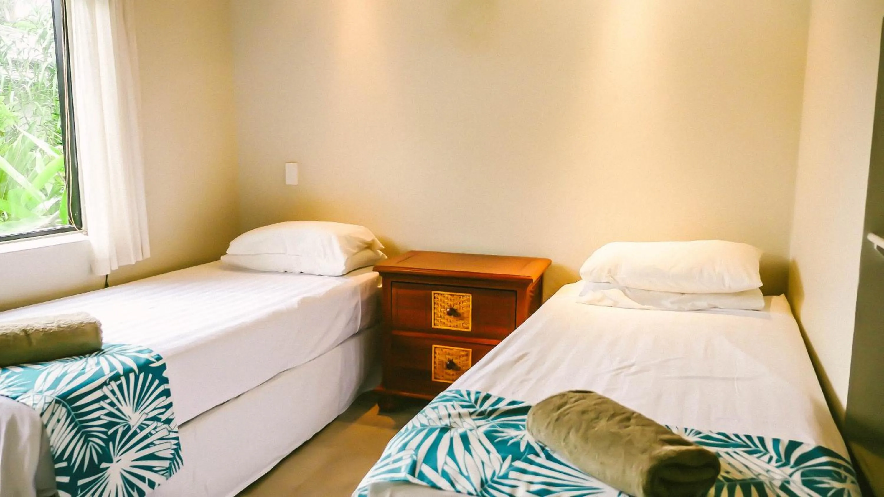 Bed in Muri Beach Resort