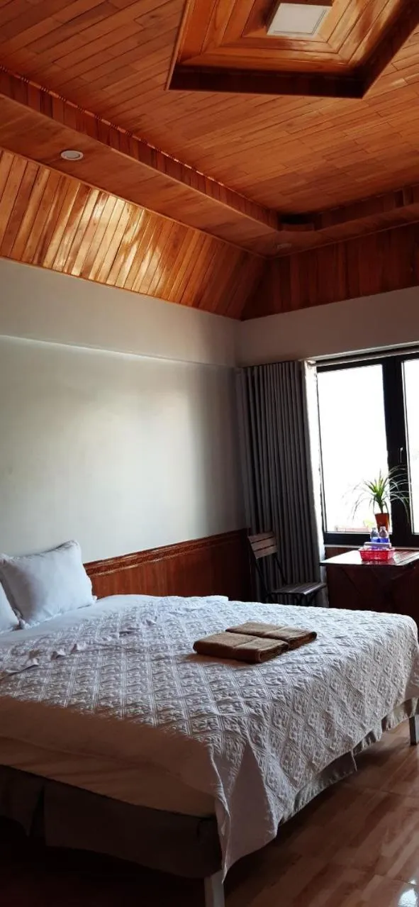 Bed in Restful River Bungalow