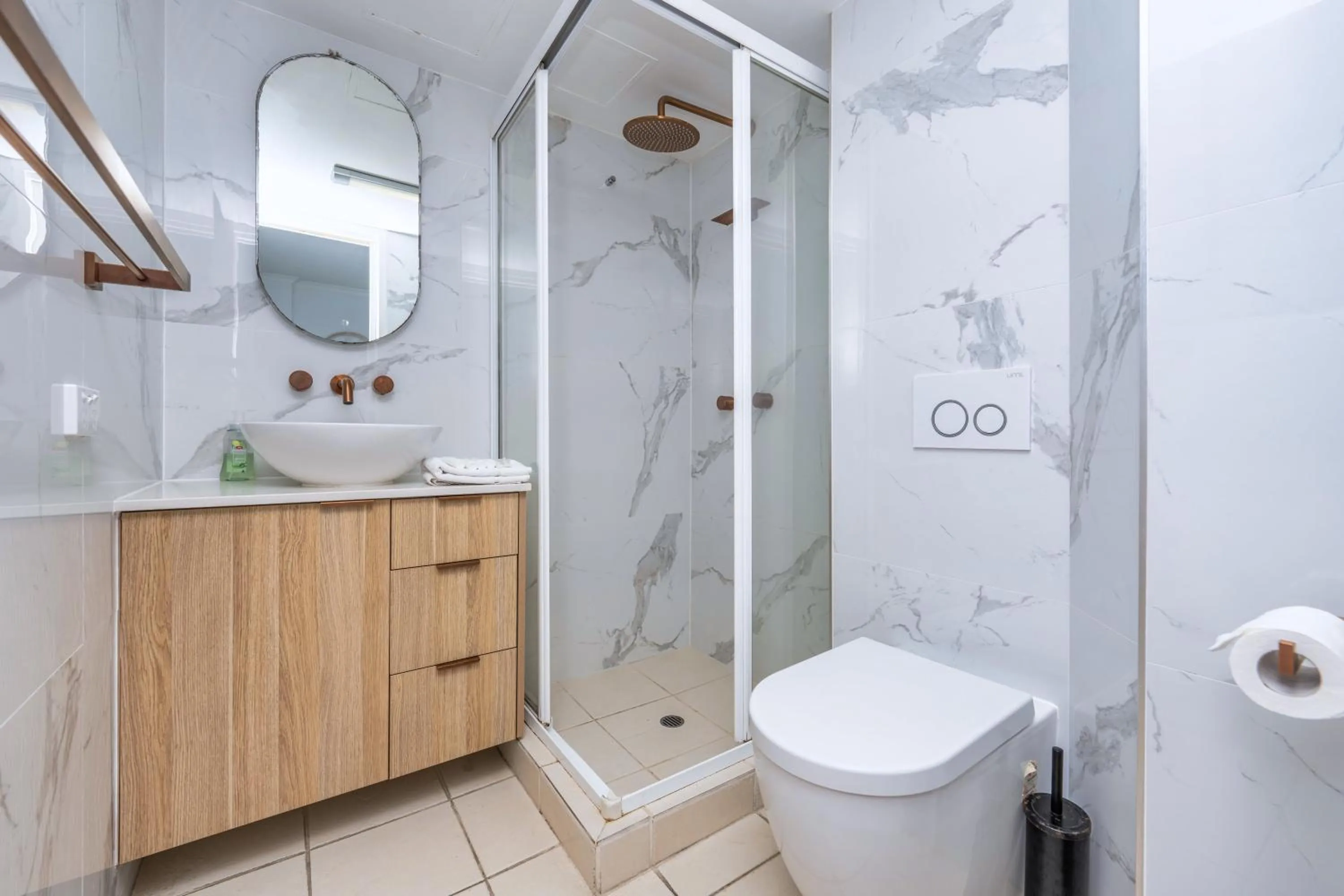 Bathroom in Olympus Beachfront Apartments