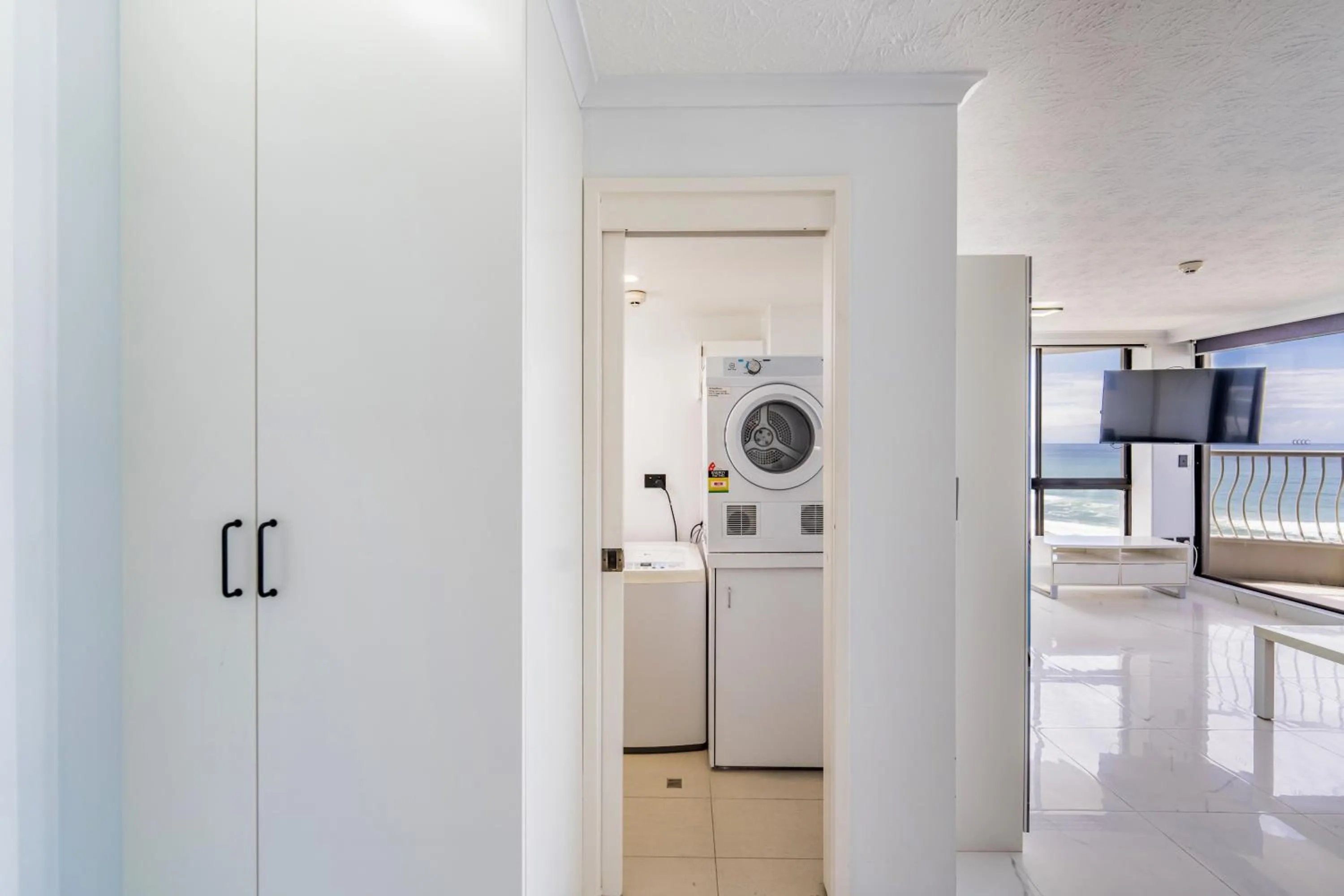 laundry in Olympus Beachfront Apartments