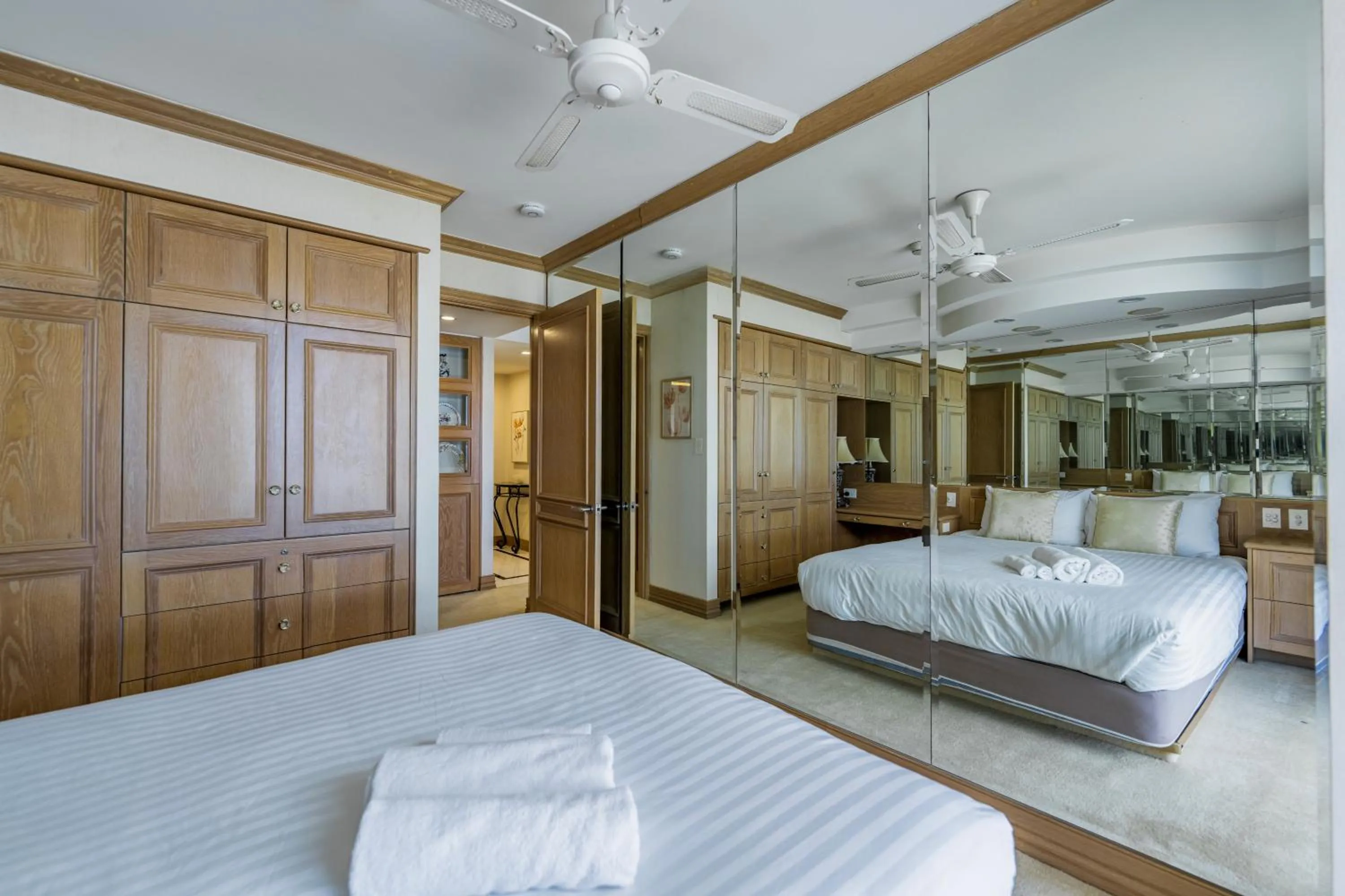 Bed in Olympus Beachfront Apartments