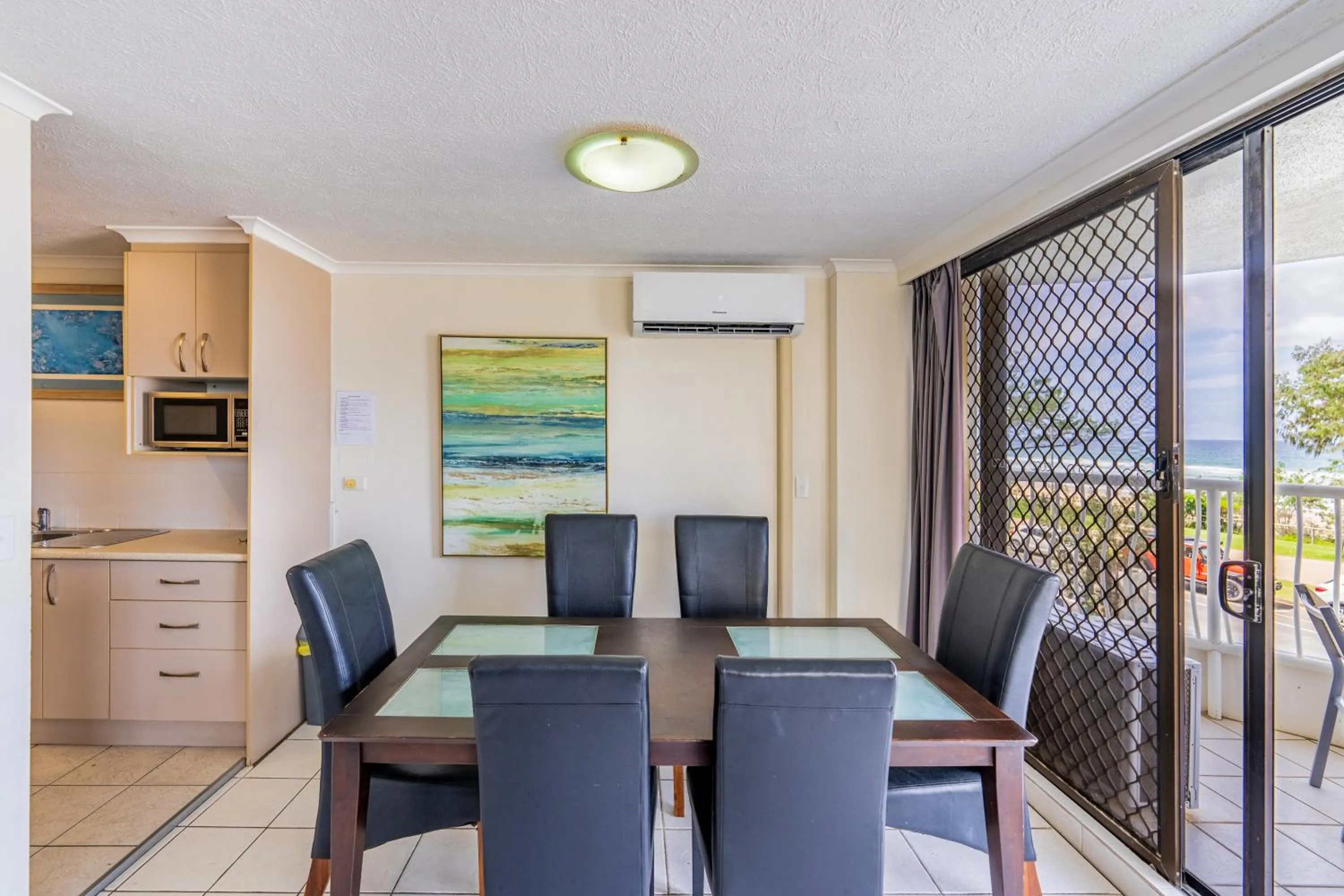 Dining area in Olympus Beachfront Apartments