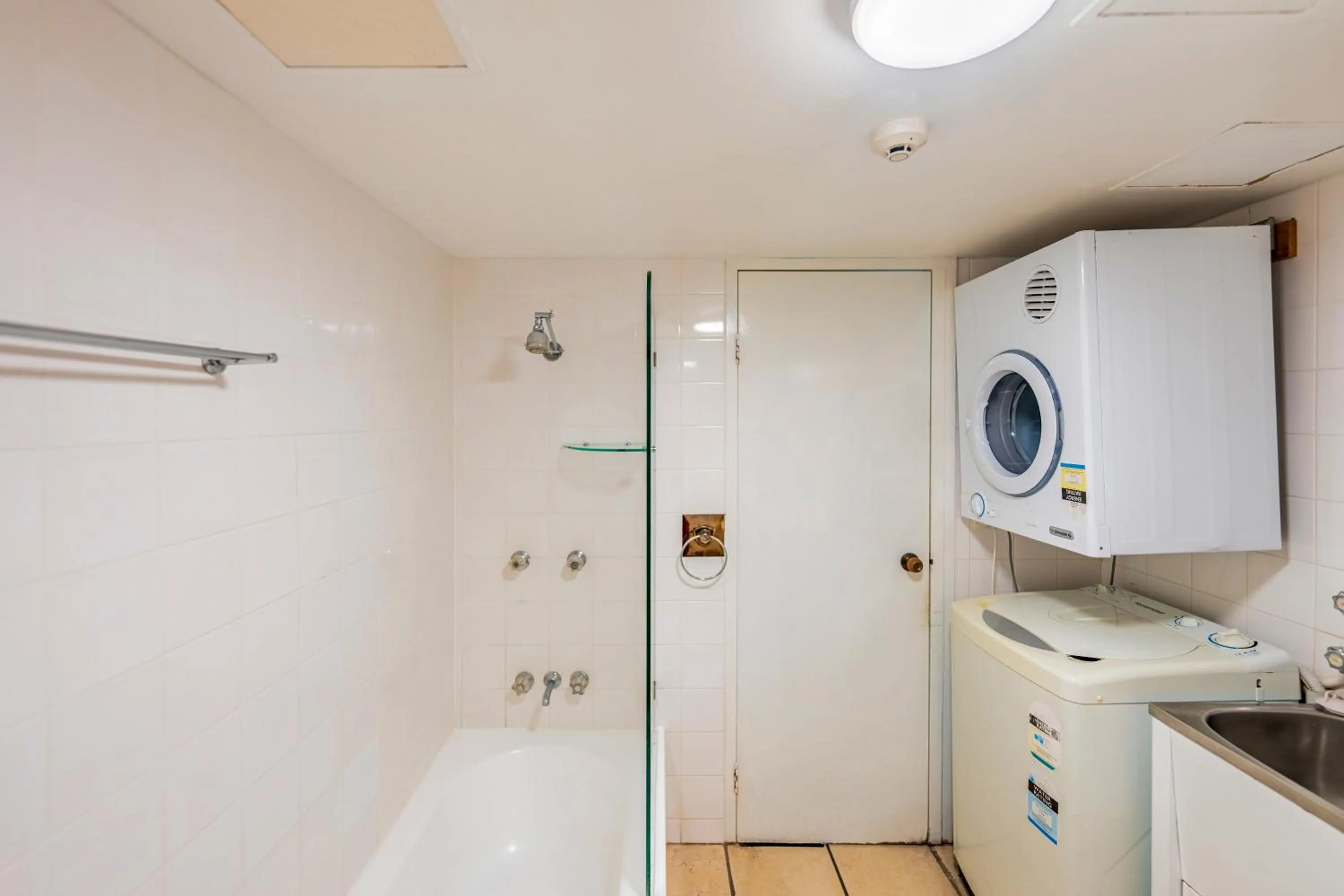 laundry in Olympus Beachfront Apartments