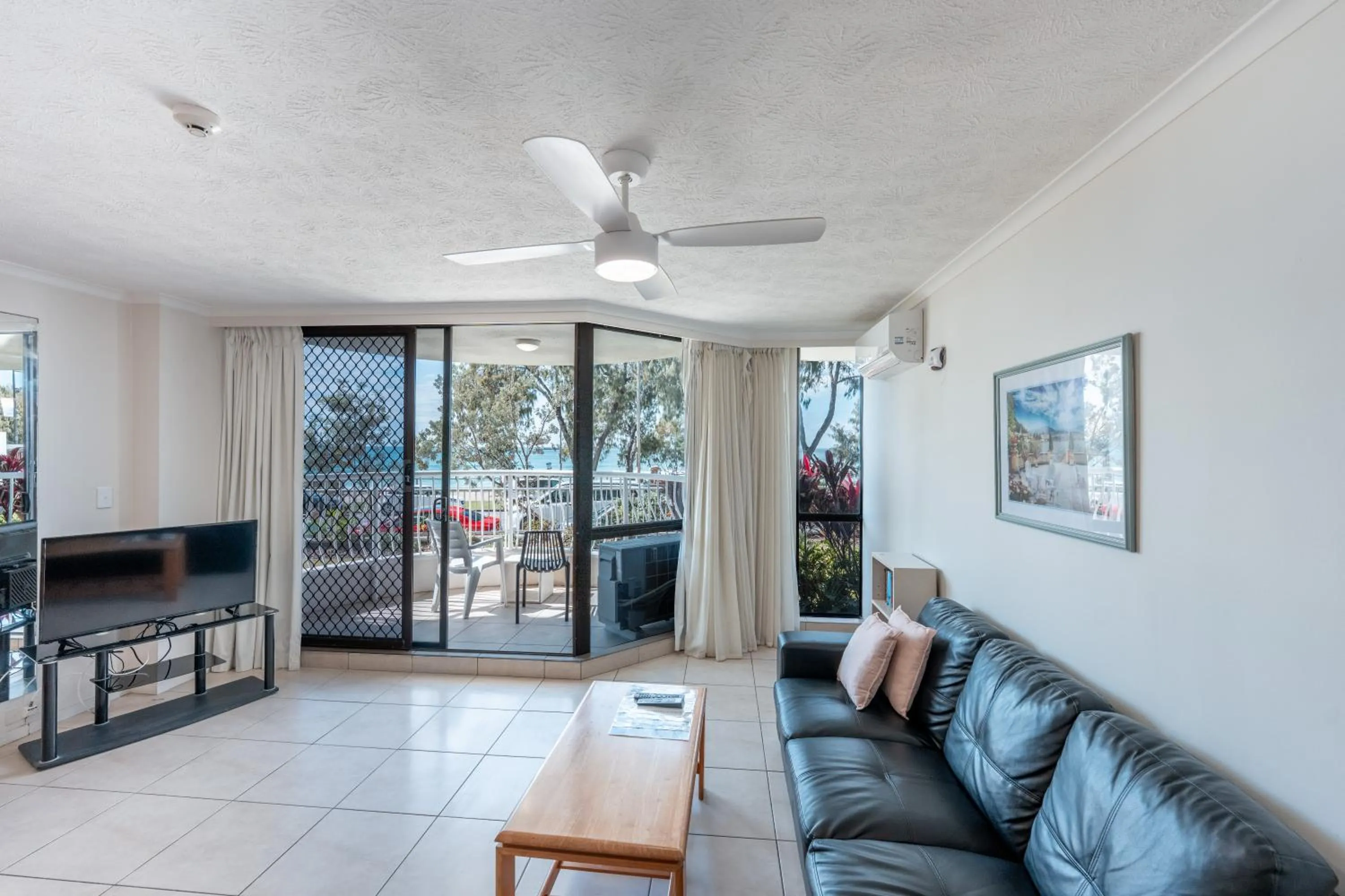 Living room in Olympus Beachfront Apartments