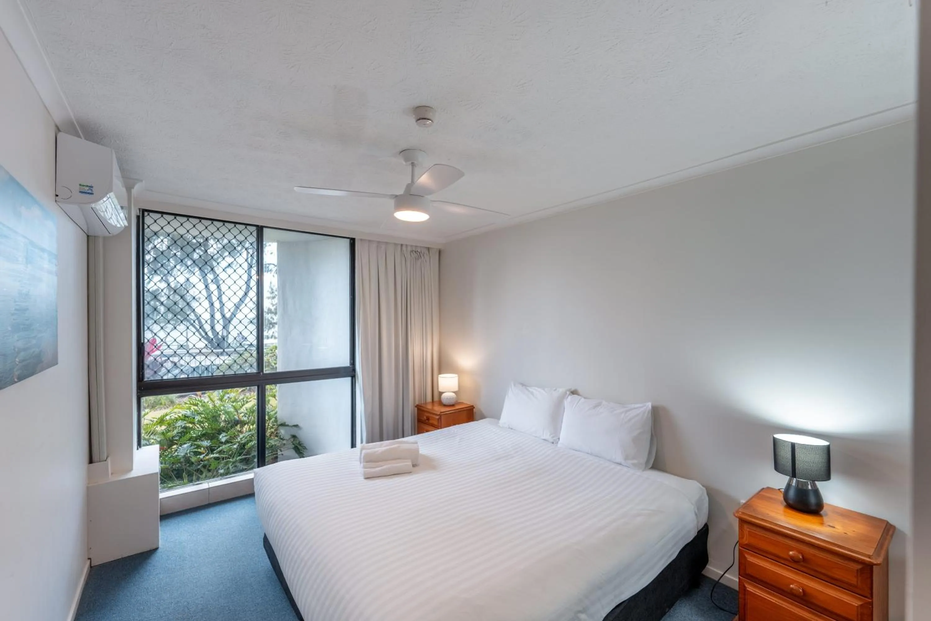 Bedroom, Bed in Olympus Beachfront Apartments