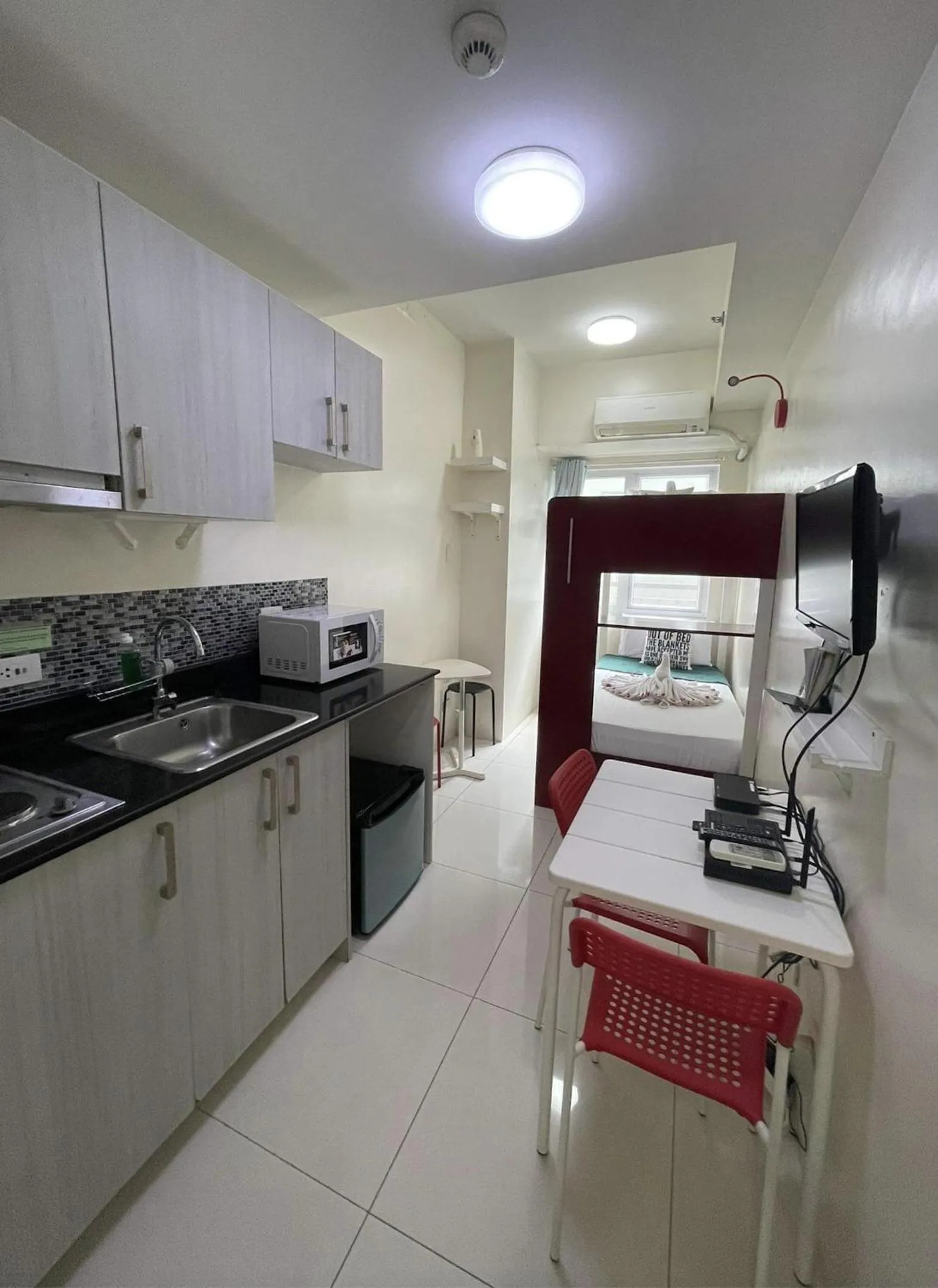 Kitchen or kitchenette in Green Residences Stays by PBYY