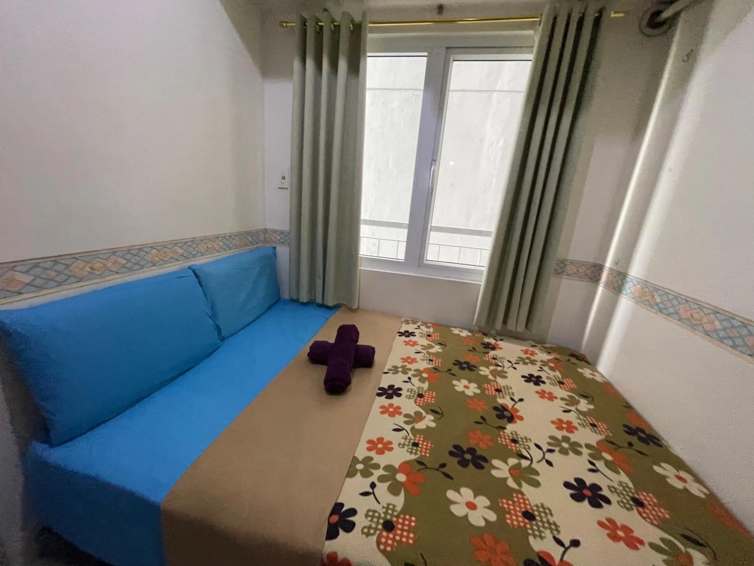 Bed in Green Residences Stays by PBYY