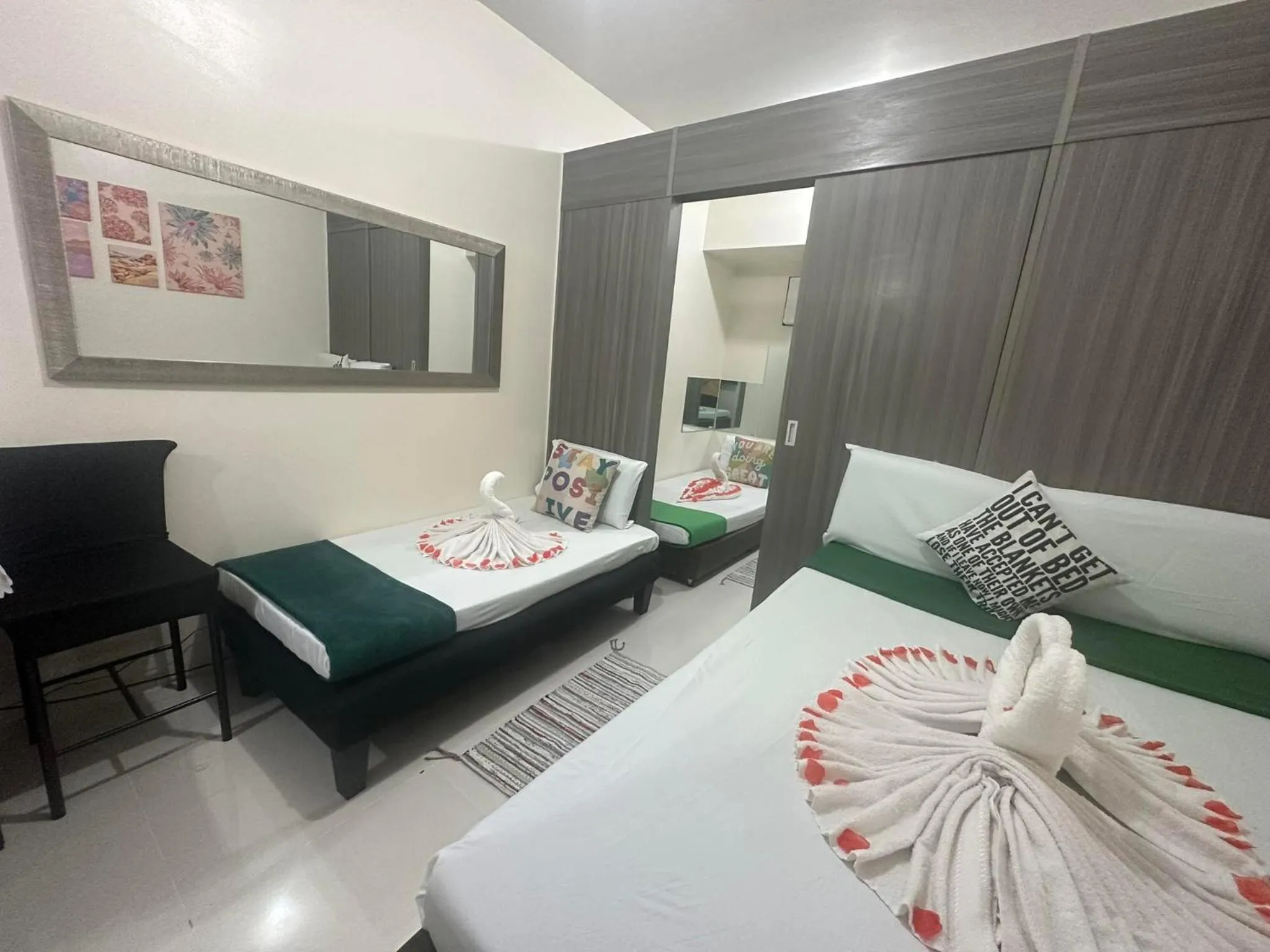 Bed in Green Residences Stays by PBYY