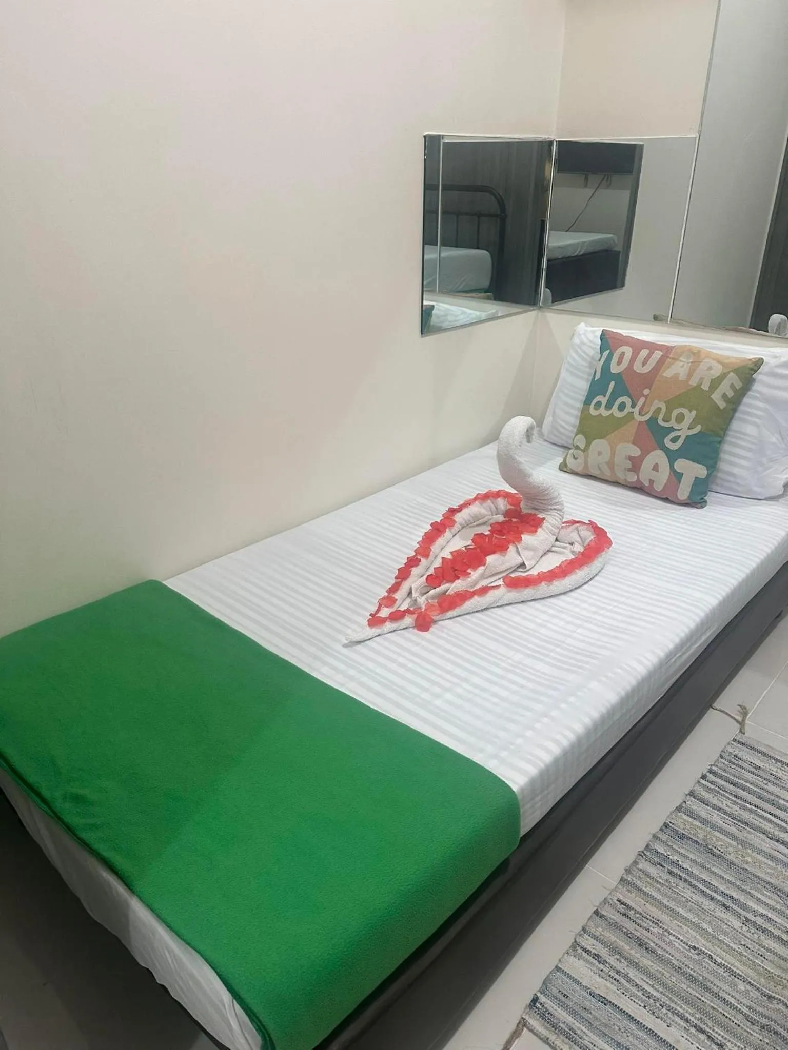 Bed in Green Residences Stays by PBYY