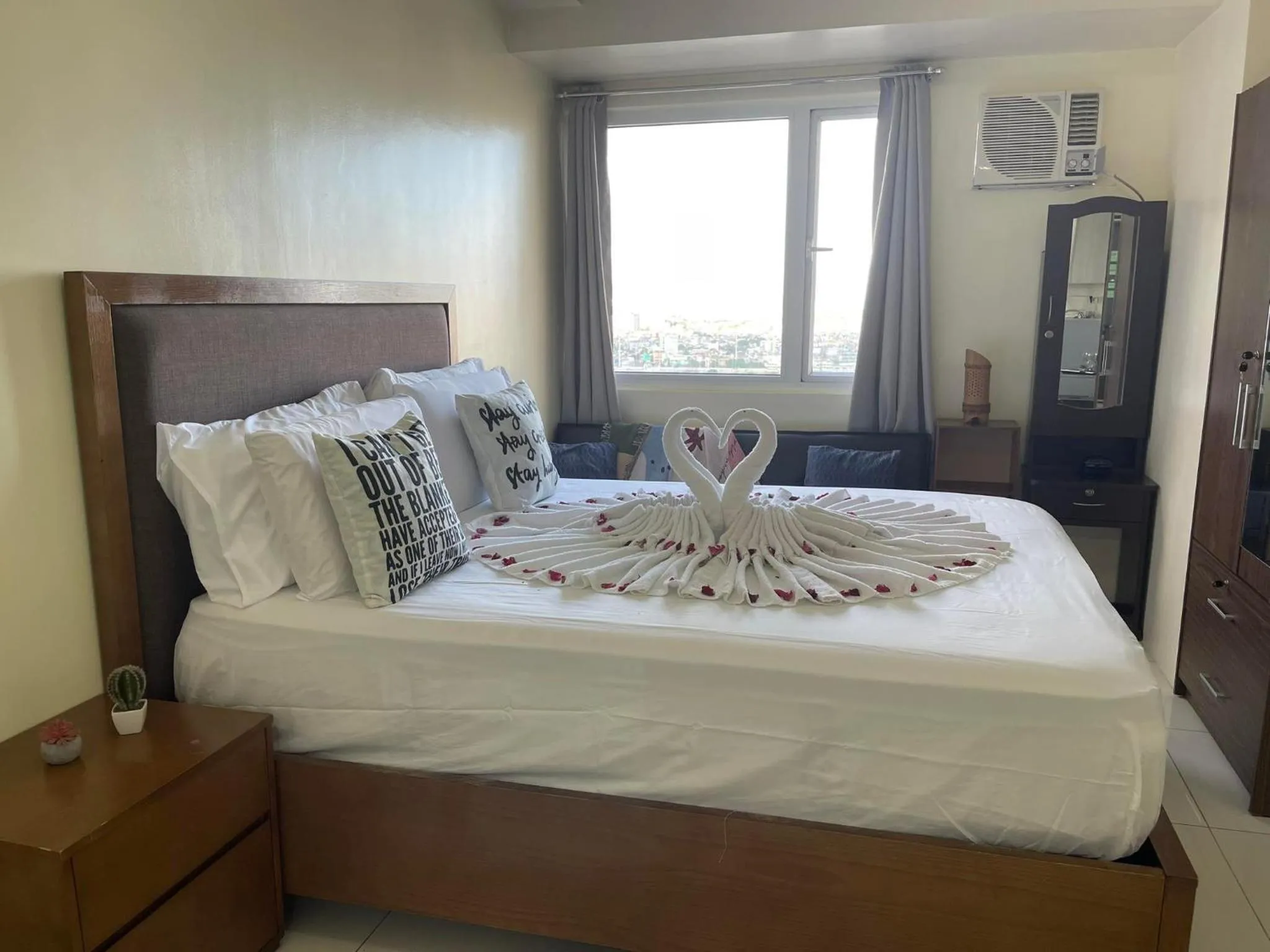 Bed in Green Residences Stays by PBYY