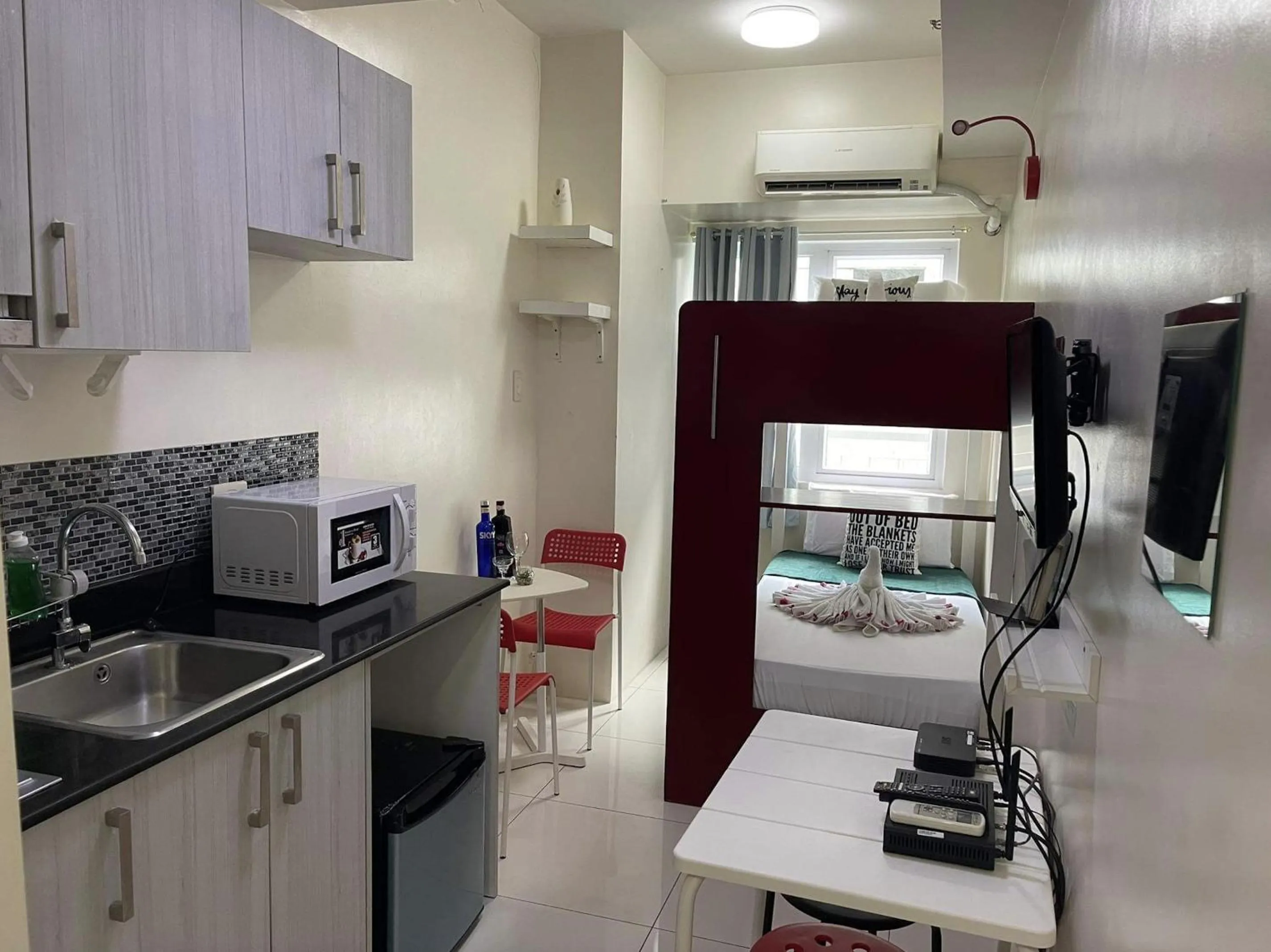 Bed in Green Residences Stays by PBYY