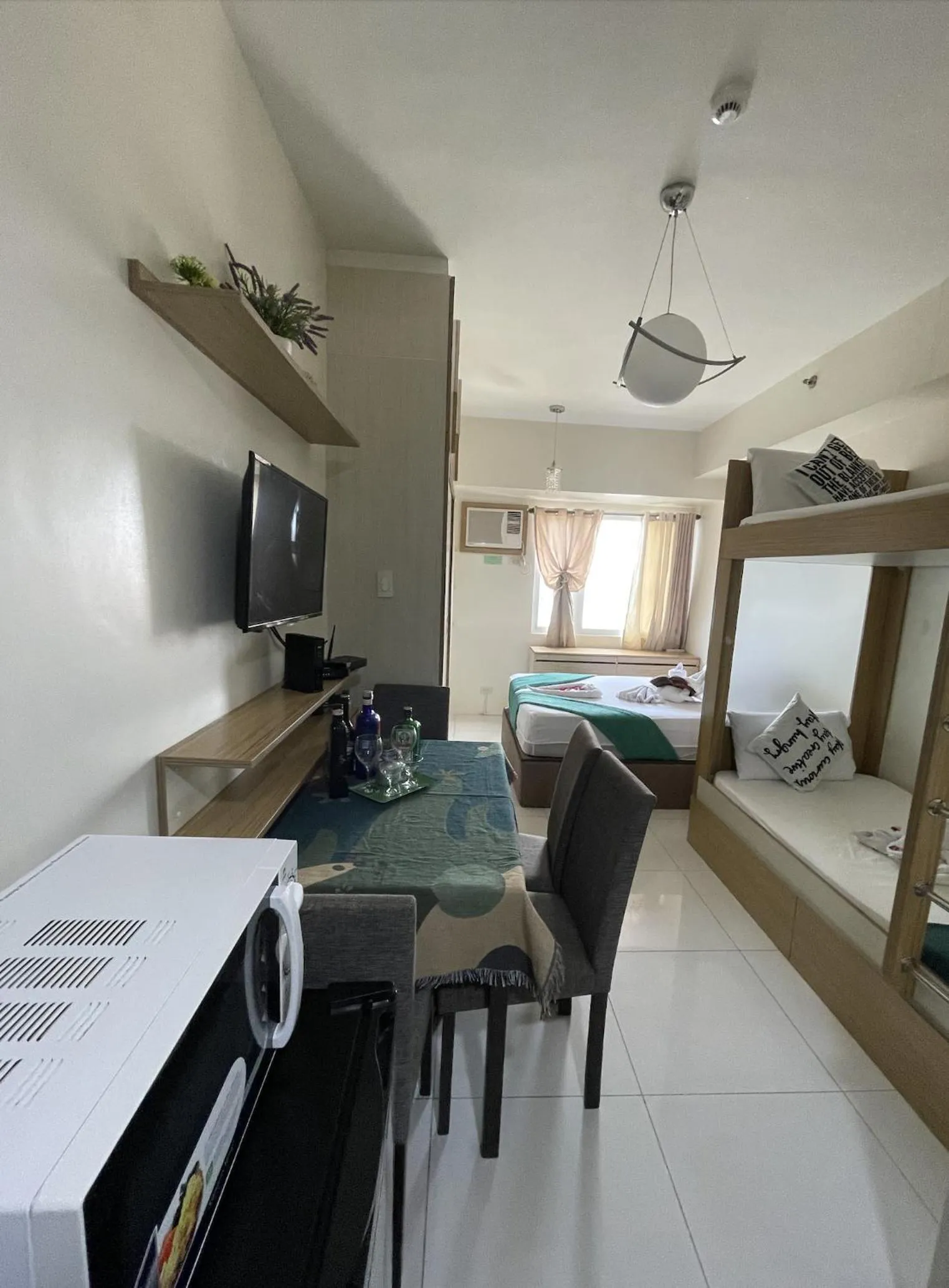 Bed in Green Residences Stays by PBYY