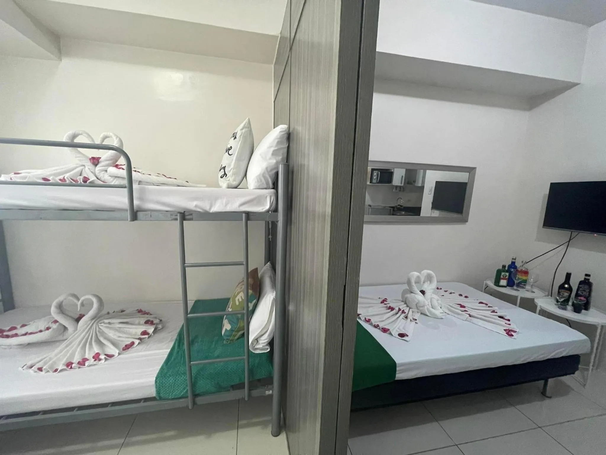 Bed in Green Residences Stays by PBYY