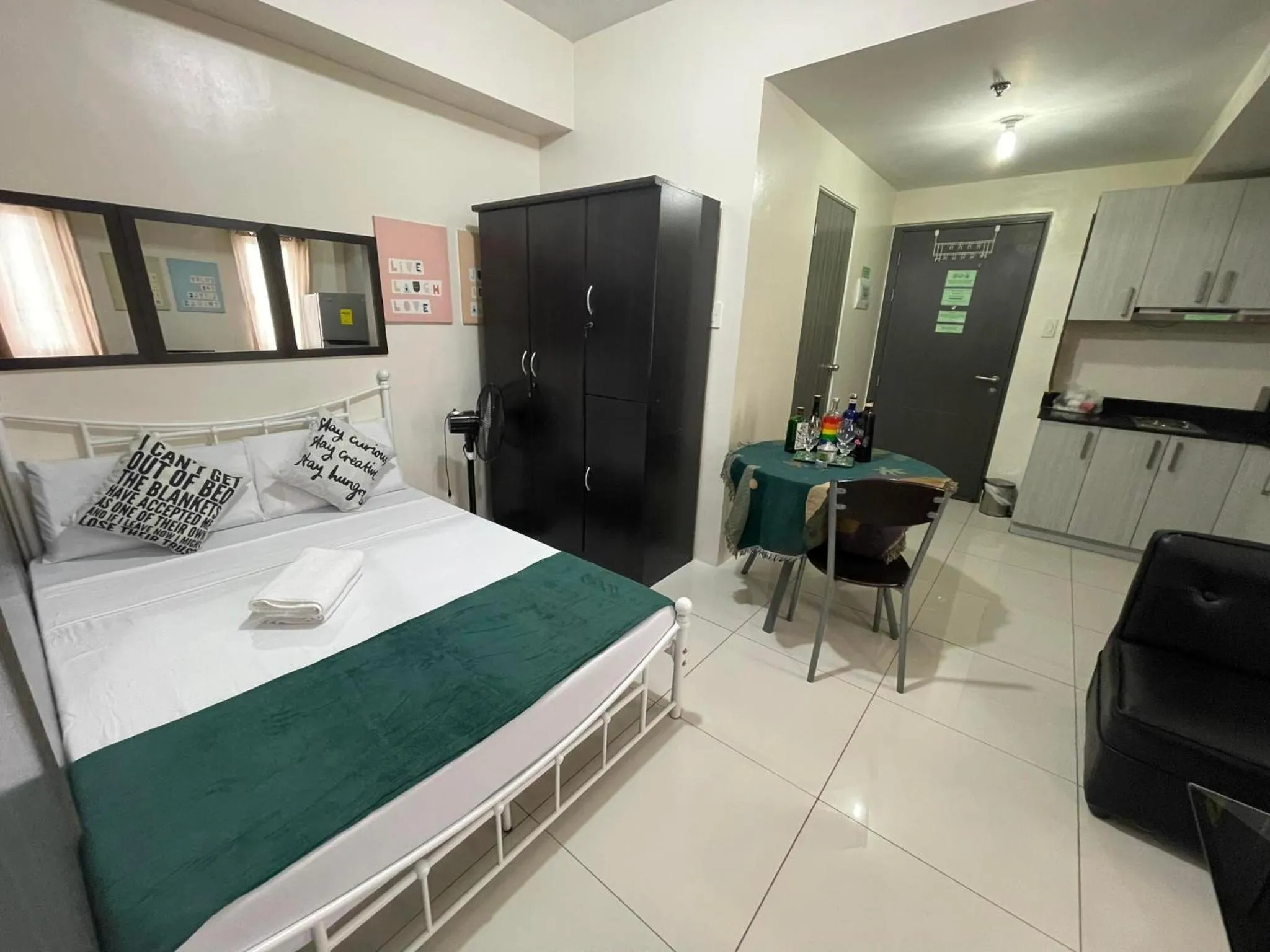 Bed in Green Residences Stays by PBYY