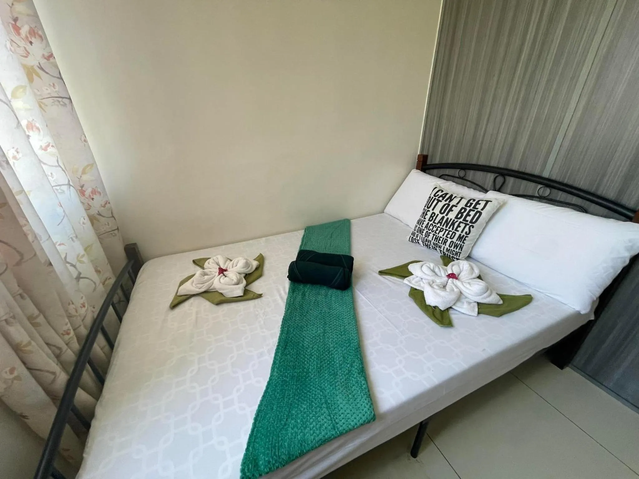 Bed in Green Residences Stays by PBYY