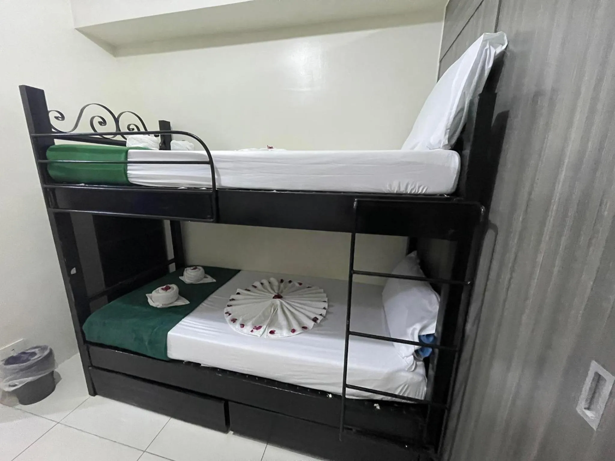 Bed in Green Residences Stays by PBYY