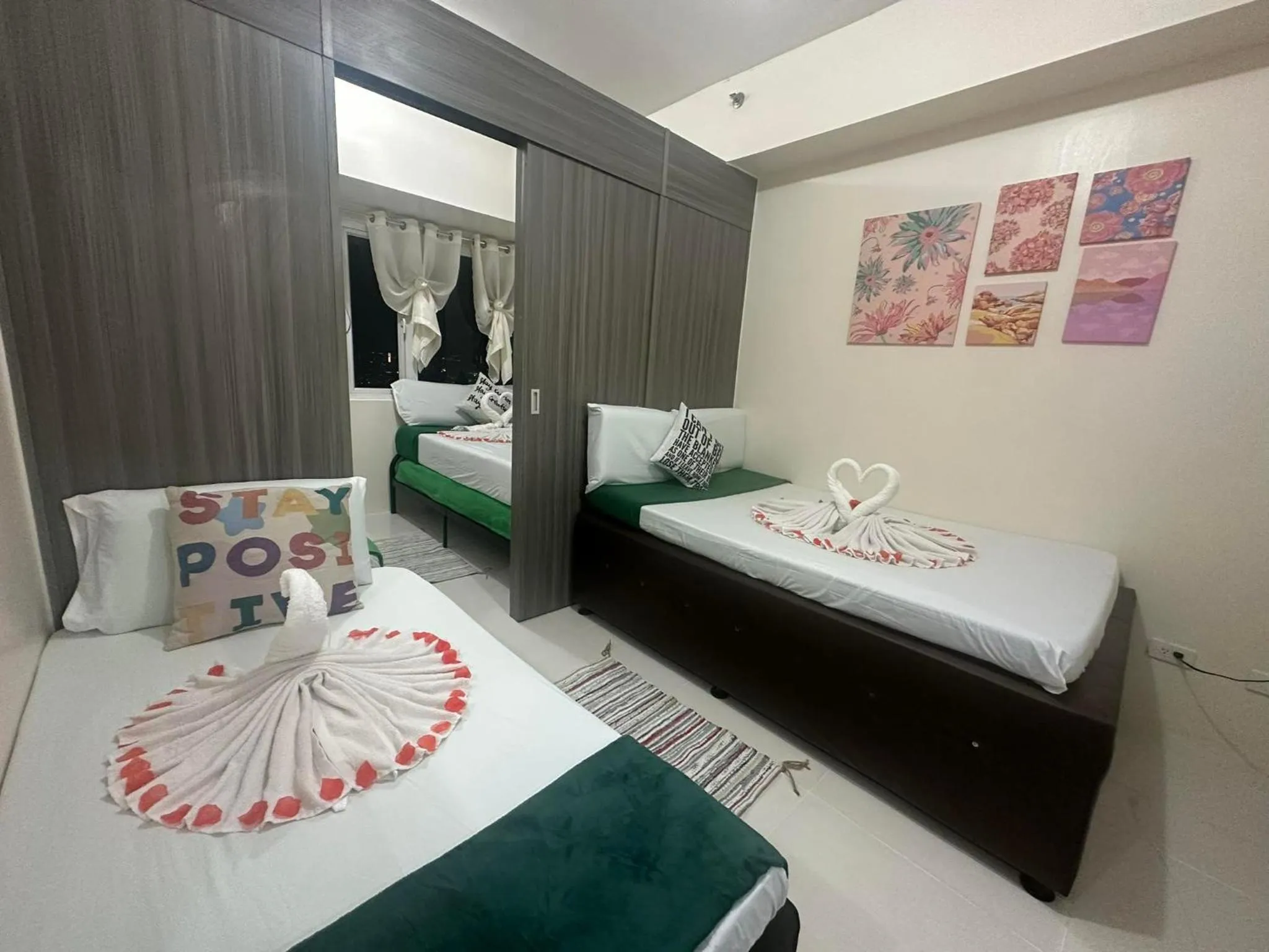 Bed in Green Residences Stays by PBYY