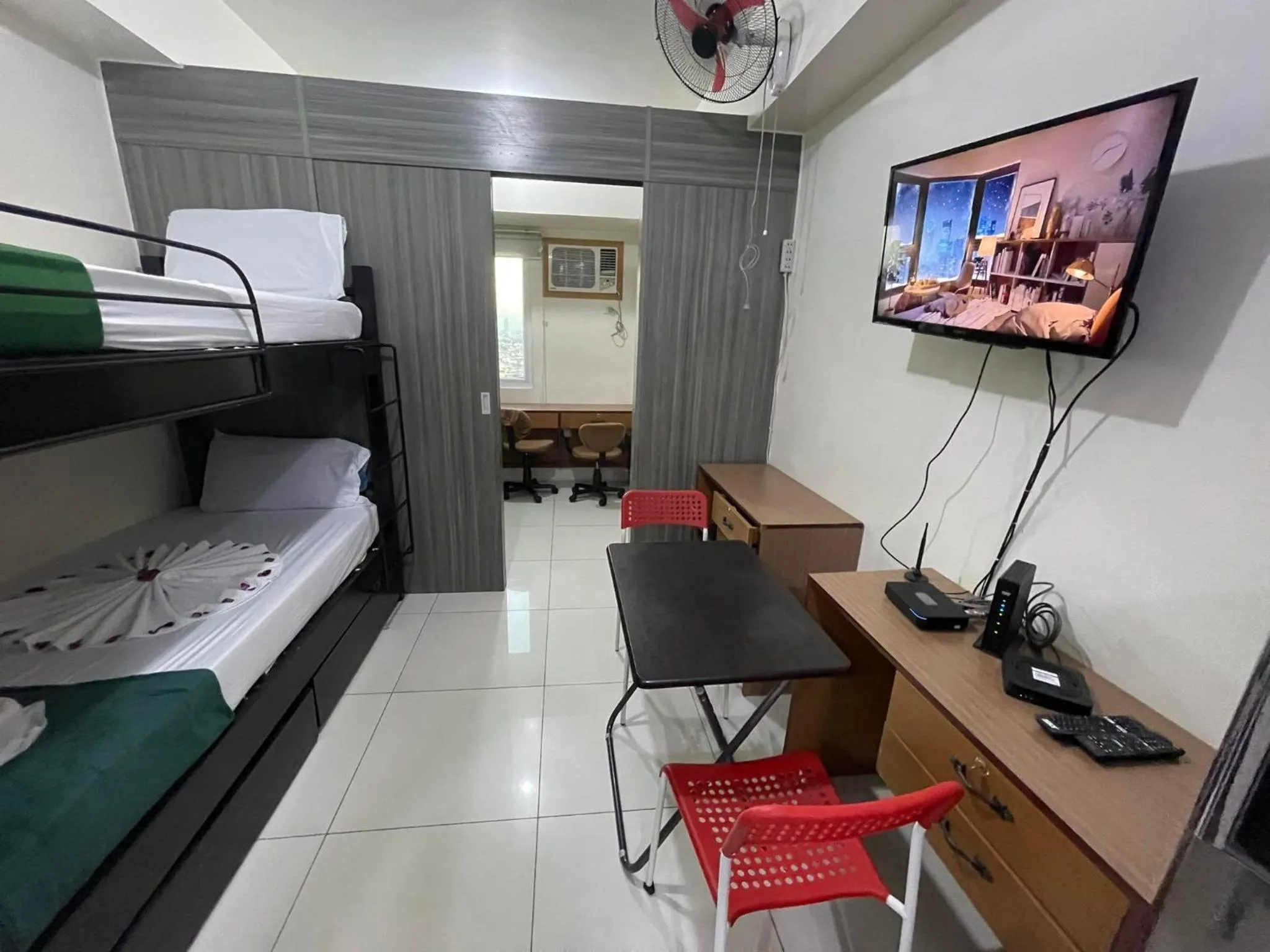 Bed in Green Residences Stays by PBYY