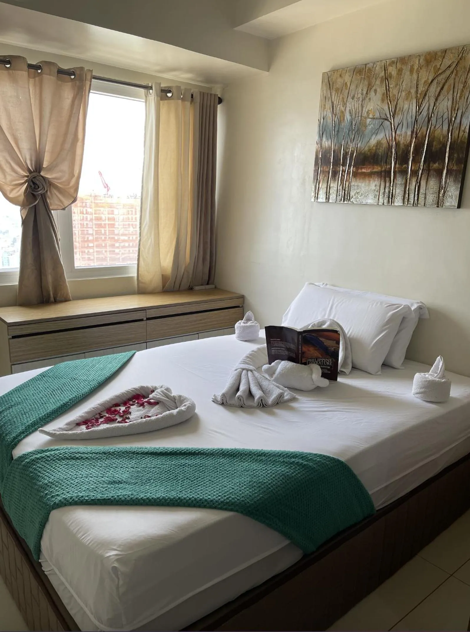 Bed in Green Residences Stays by PBYY