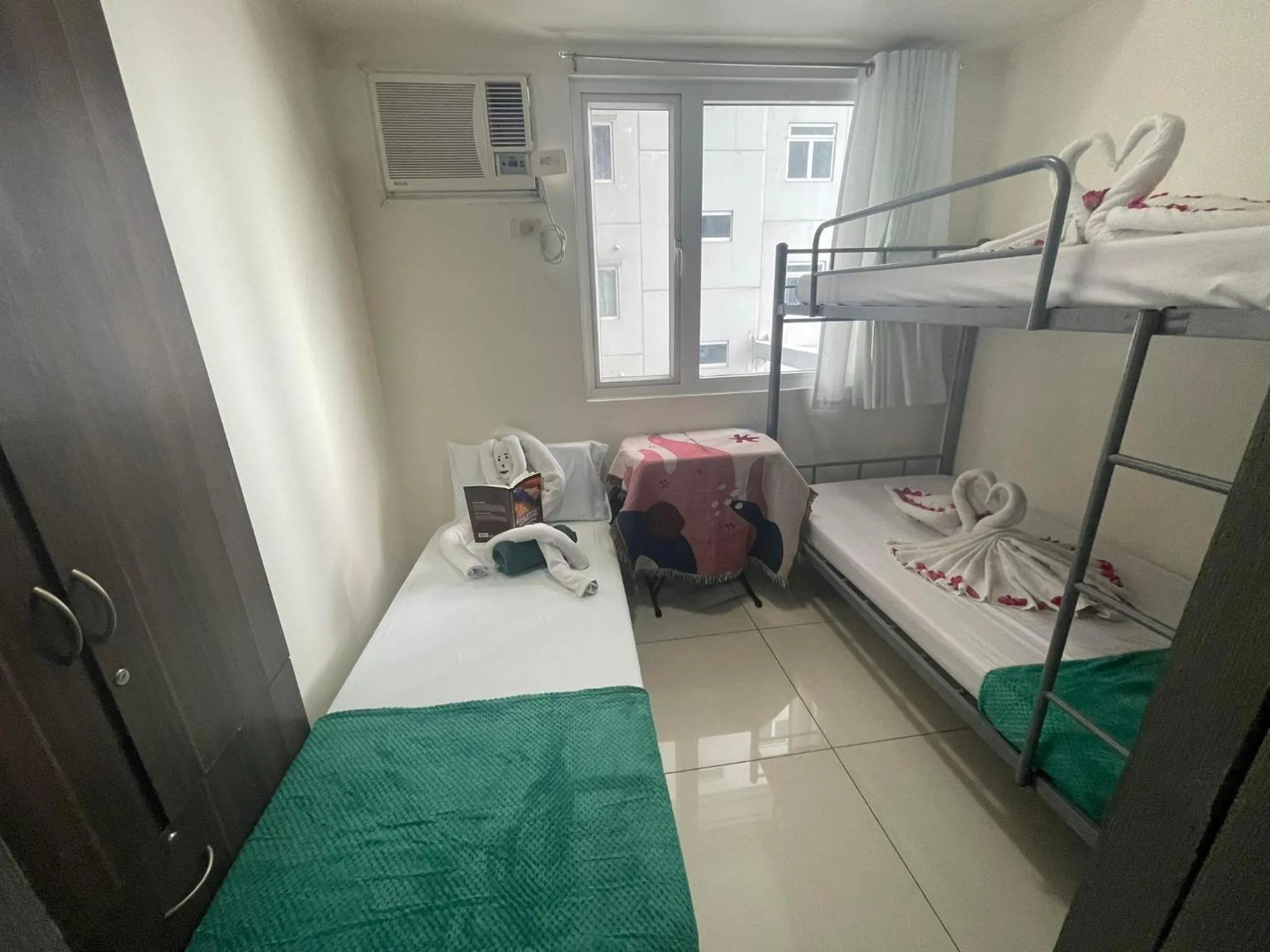 Bed in Green Residences Stays by PBYY