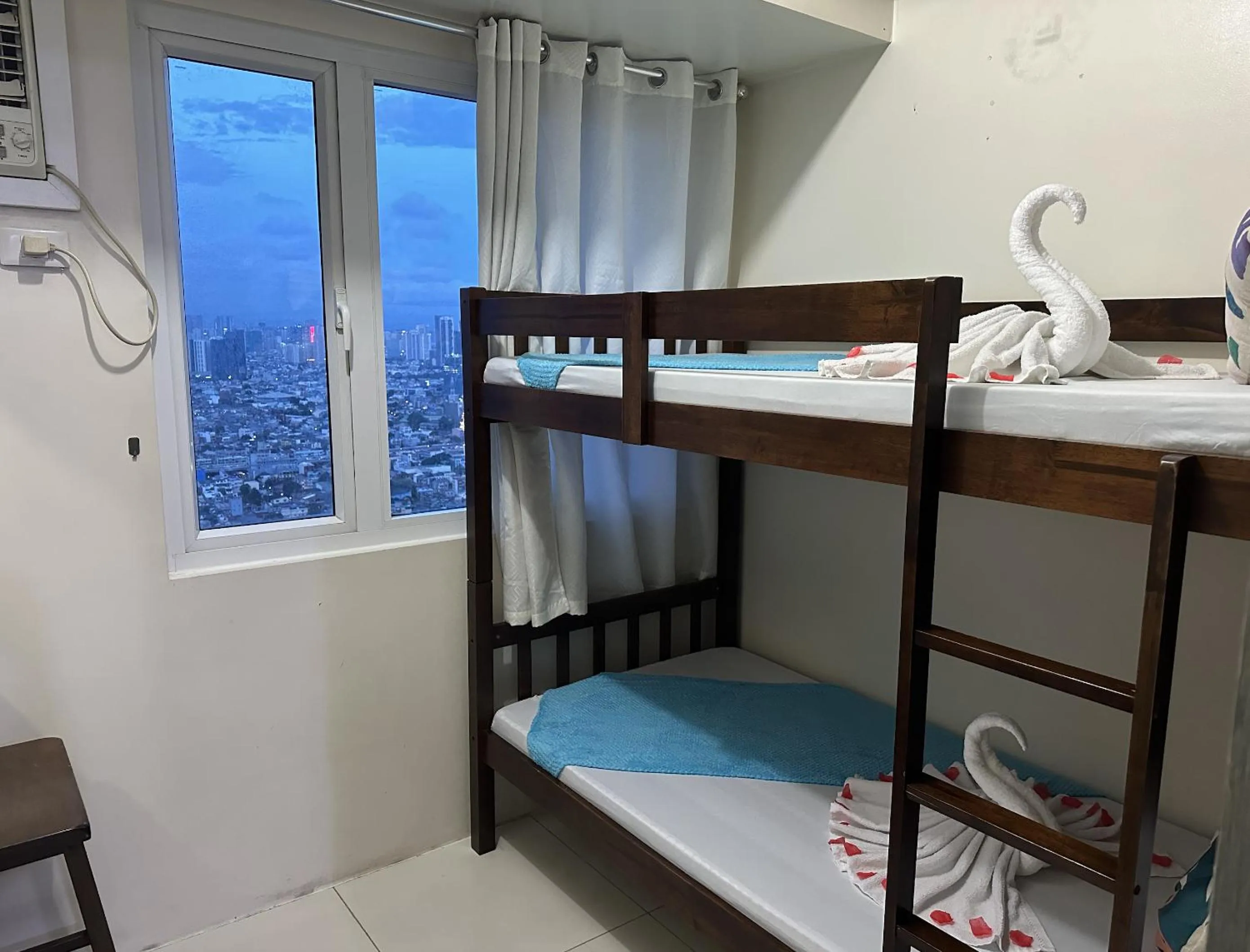 Bed in Green Residences Stays by PBYY