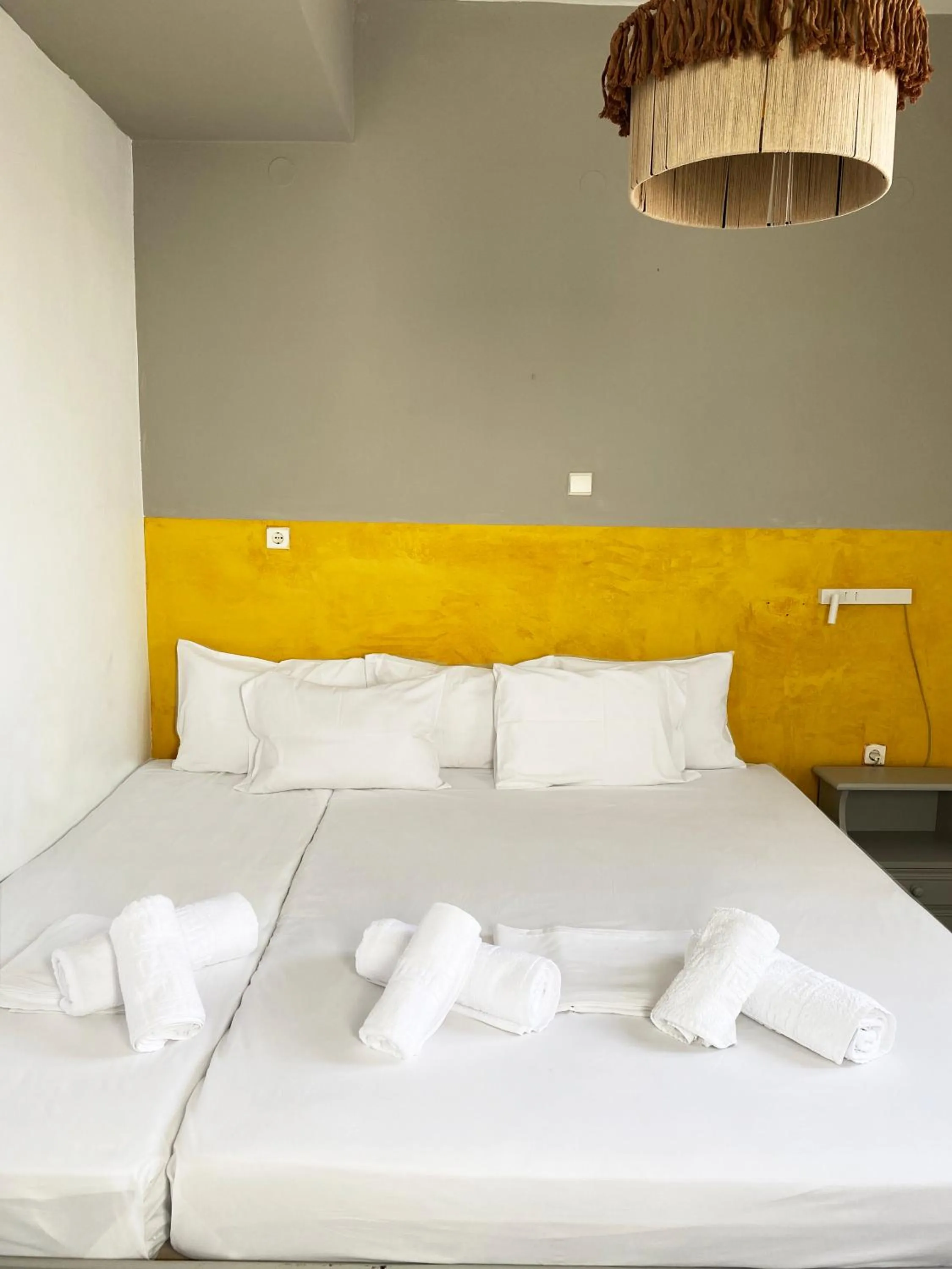 Bed in Agnadi Syros Beachfront Studios & Rooms