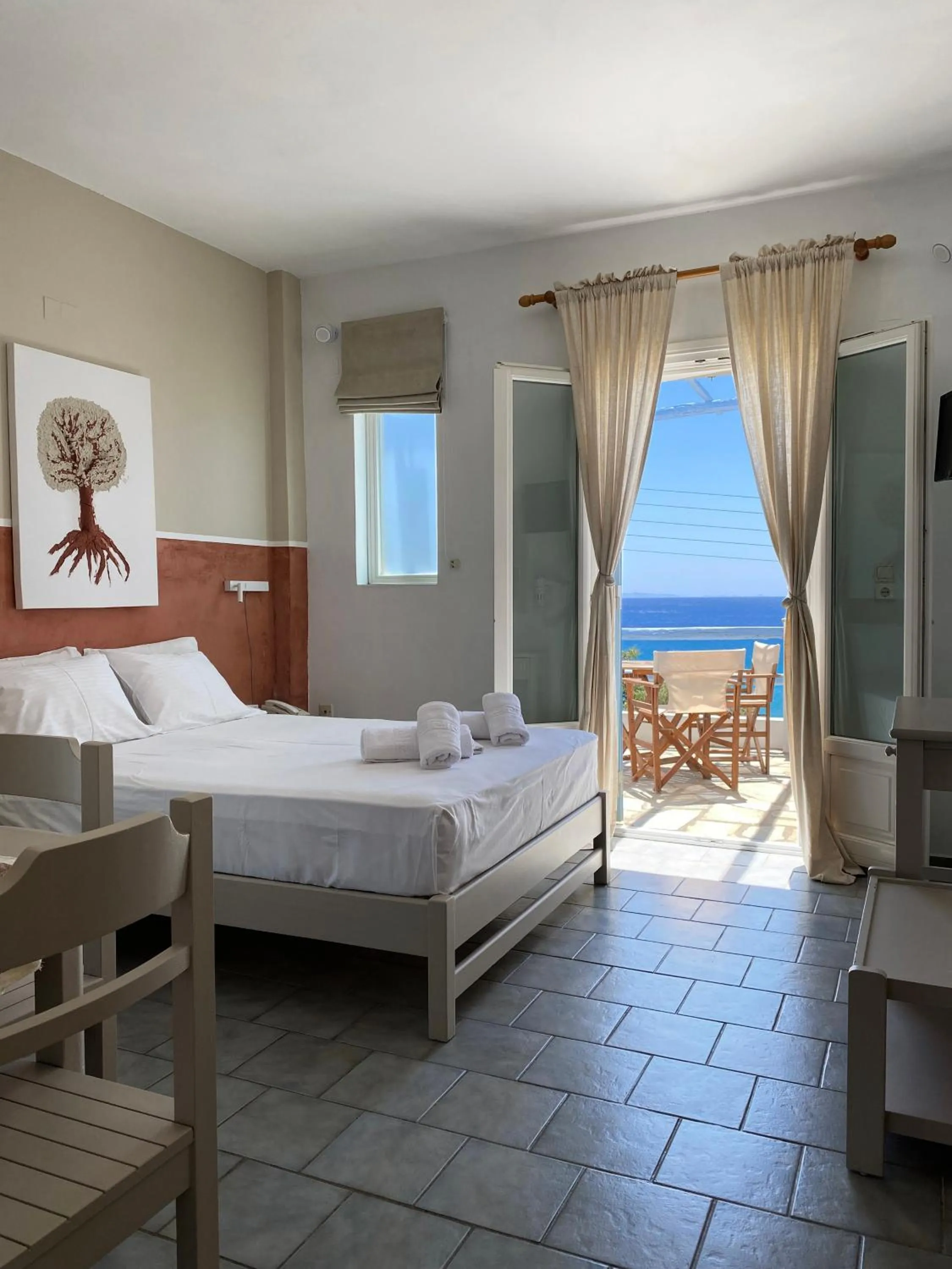 Bed in Agnadi Syros Beachfront Studios & Rooms