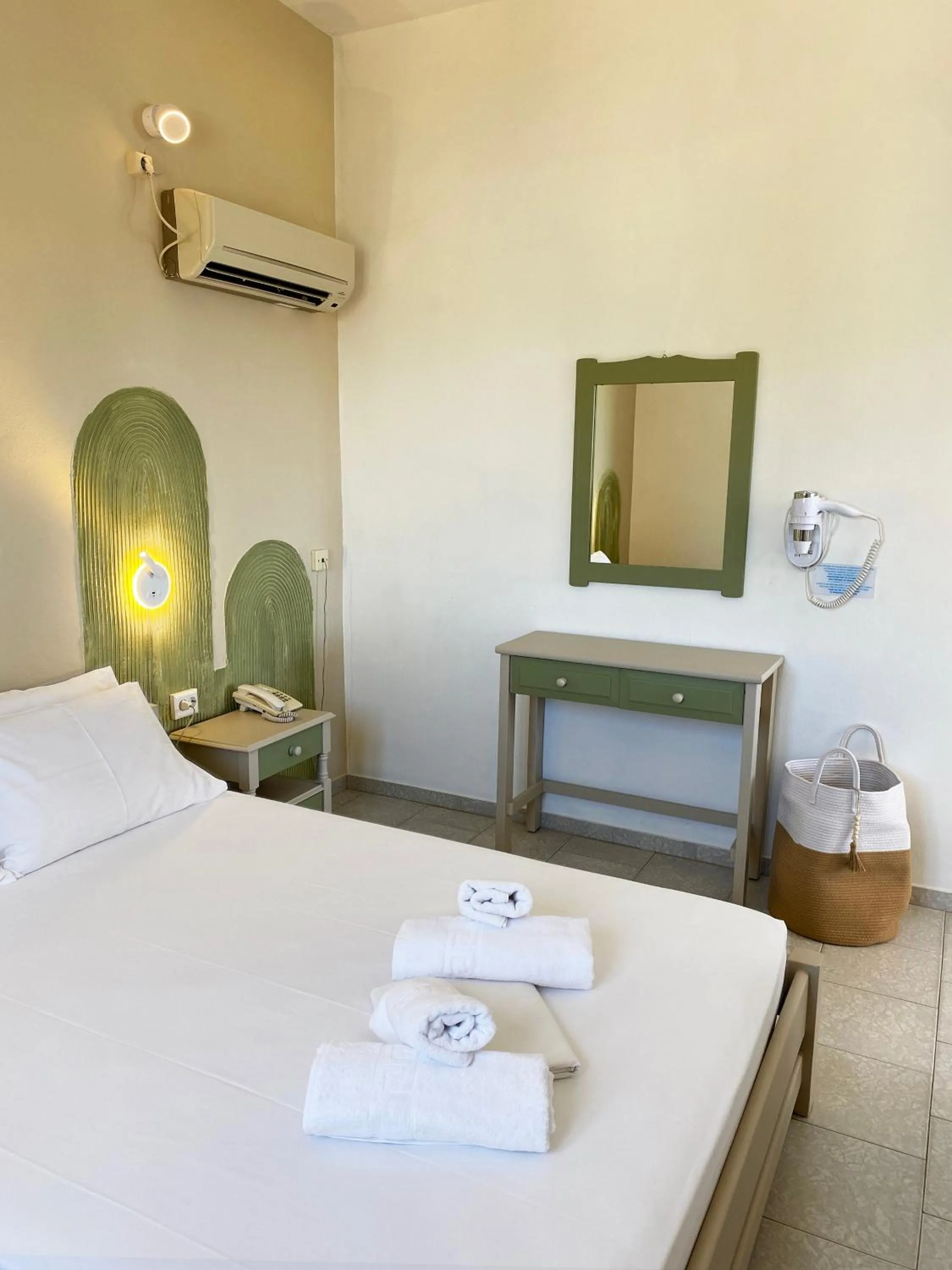 Bed in Agnadi Syros Beachfront Studios & Rooms